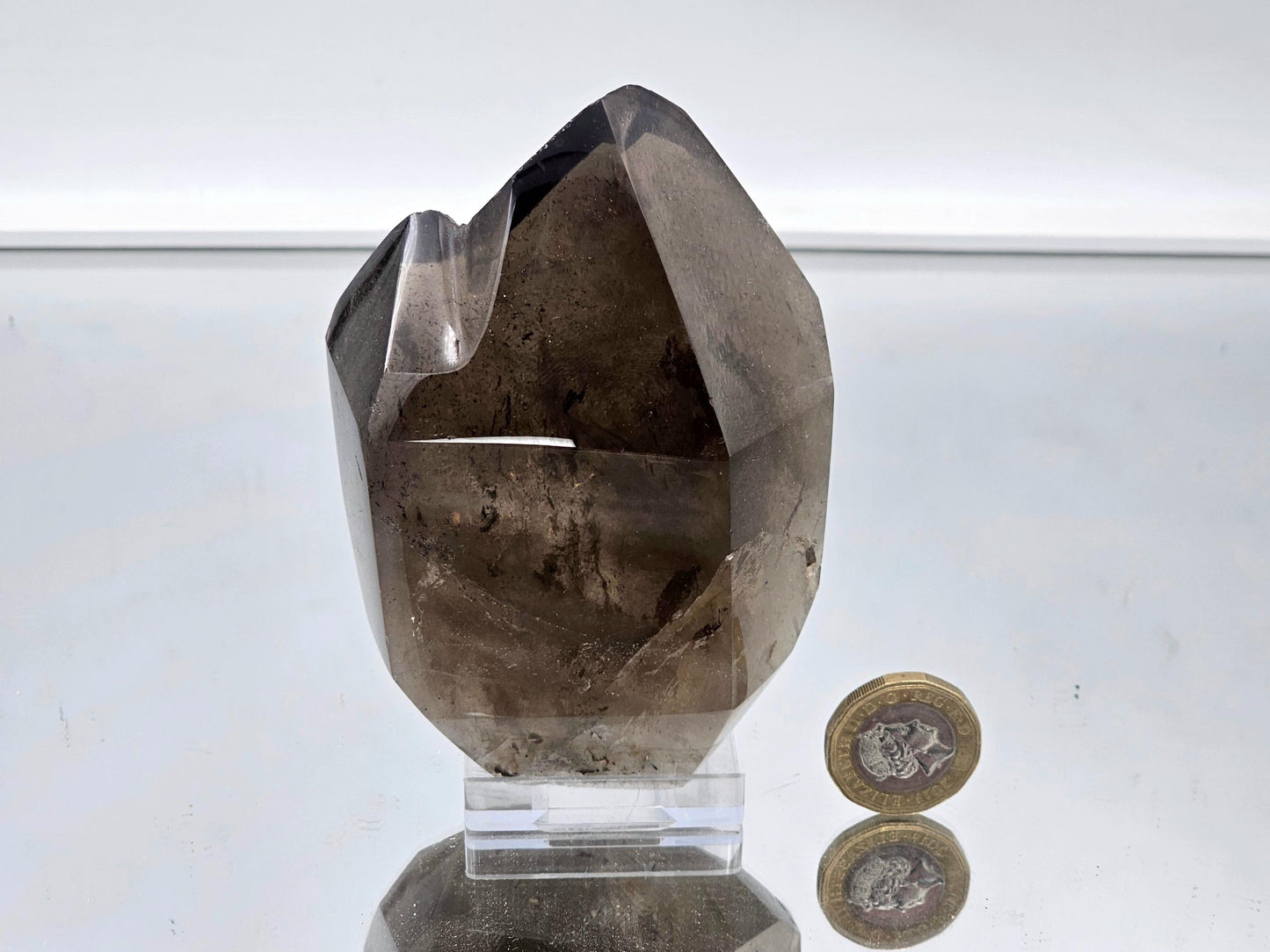 Polished smoky quartz crystal centerpiece, perfect for luxury decor.