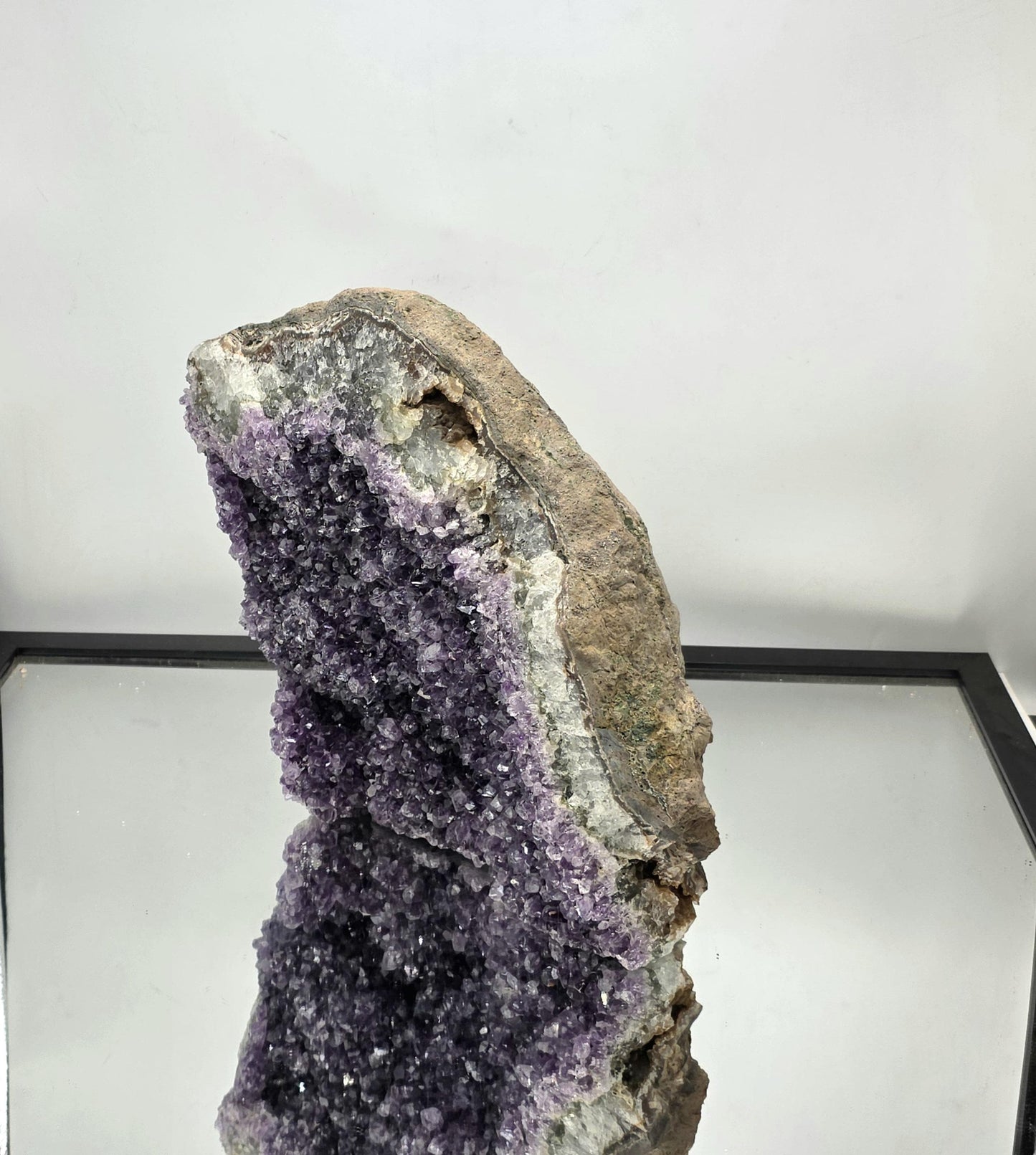 A naturally rough-sided Amethyst geode for interior décor.