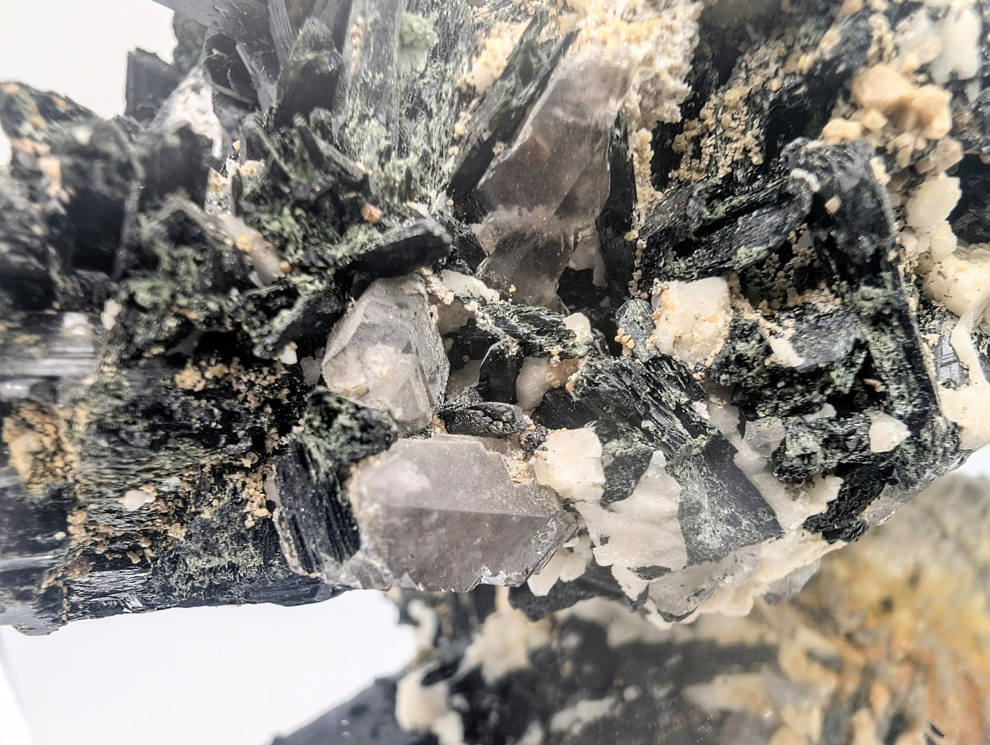 Collector crystal piece featuring black Aegirine and clear Quartz.