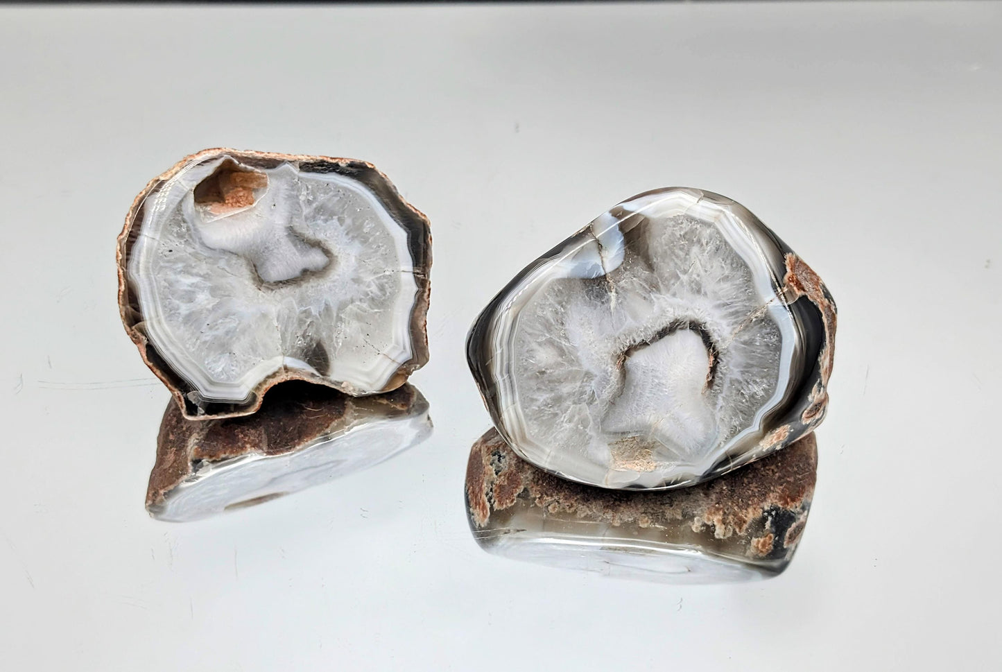 Natural agate specimens featuring prominent black bands.