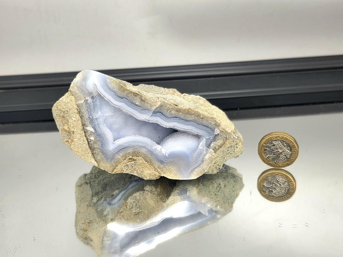 Sparkling druzy formation inside Blue Lace Agate