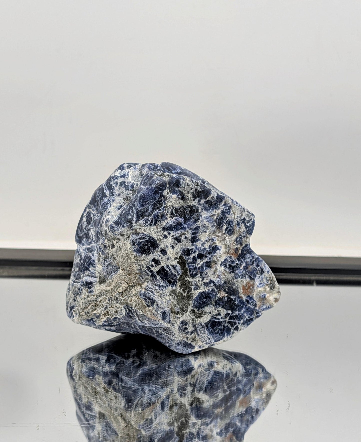 Large blue Sodalite crystal freeform styled for home décor.