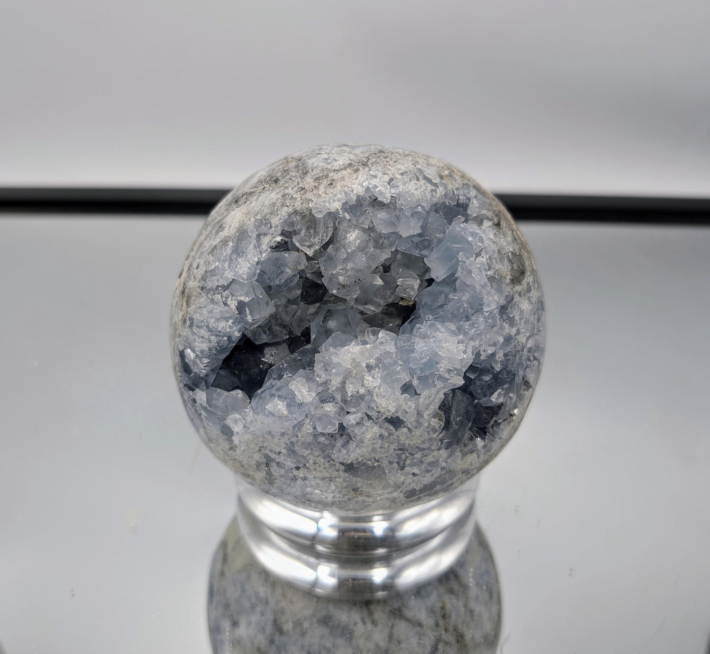 Celestial Celestite Sphere displayed as a tranquil décor accent.