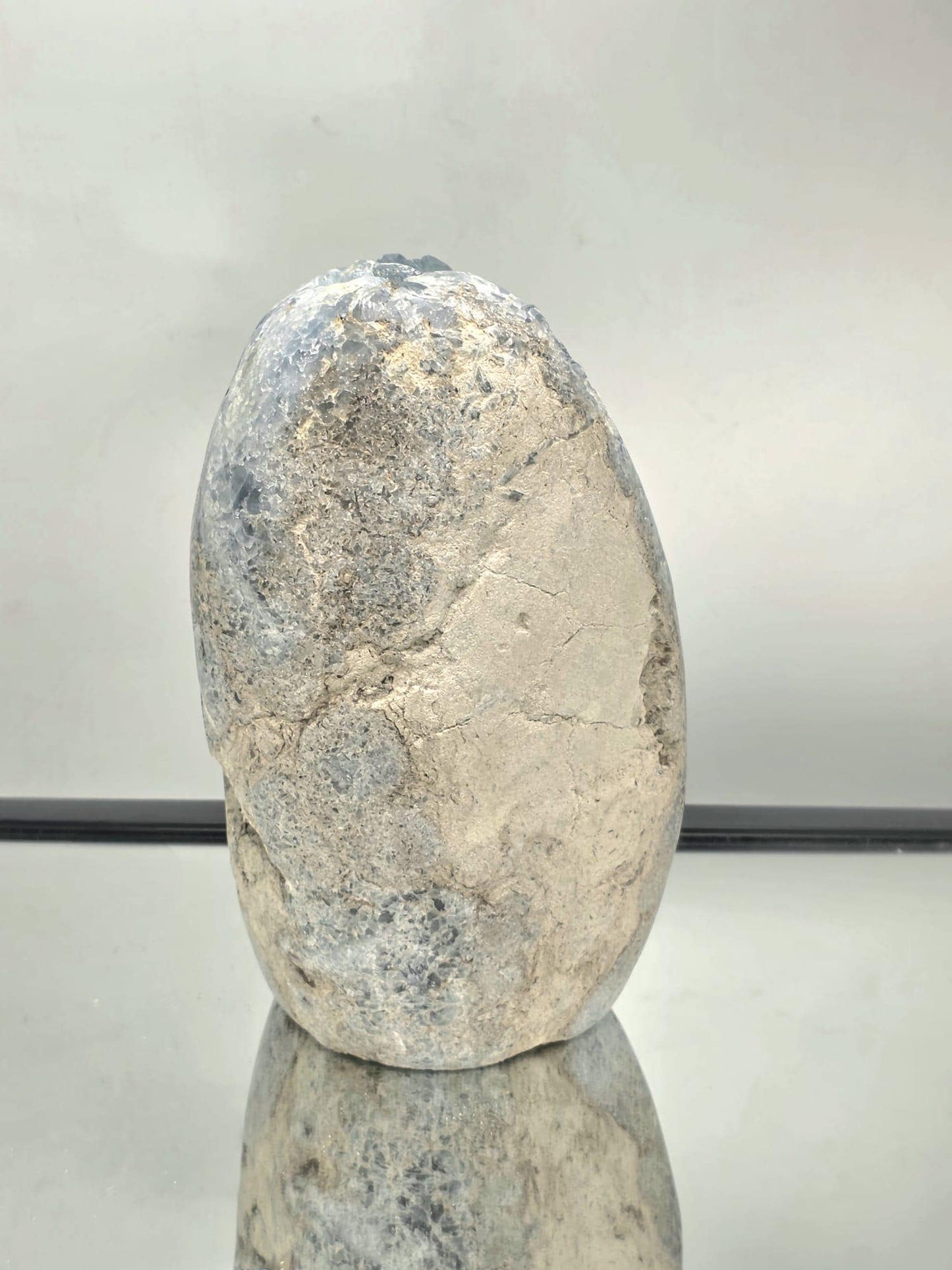 Rear view of the Celestite freeform showing texture, natural base, and crystal formation details.