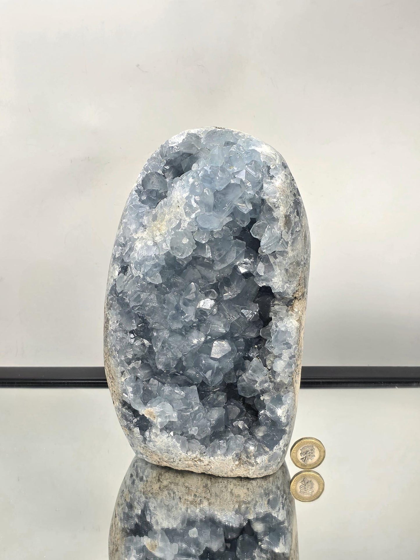 Side profile highlighting the depth and clarity of the Celestite crystals in natural light.