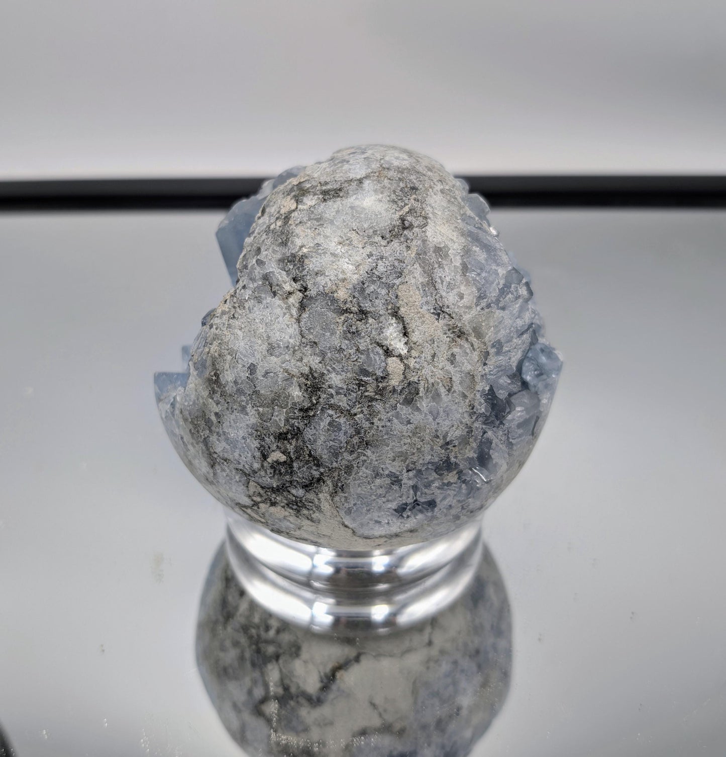 Luxury home décor with a radiant Celestite Crystal Sphere centerpiece.