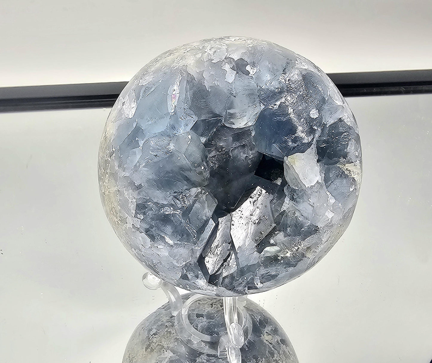 Elegant home style enhanced by a Celestite Sphere.