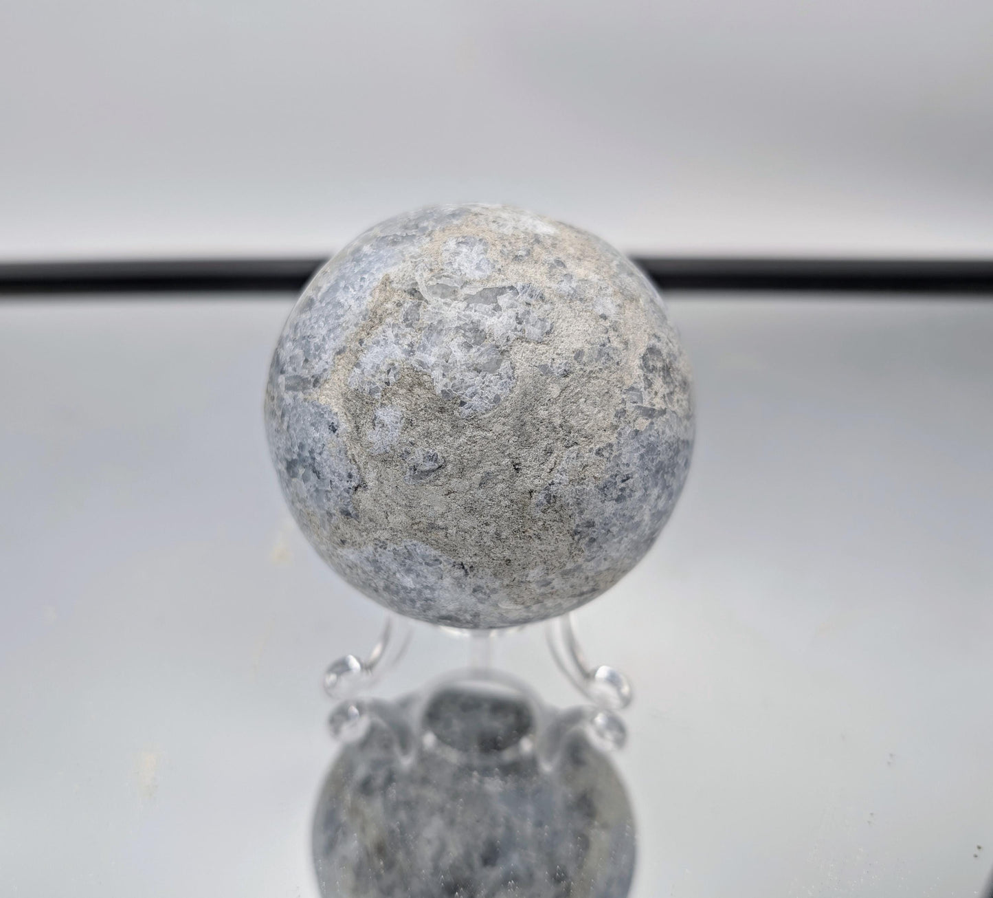 Celestite Sphere placed as a peaceful accent in living room décor.