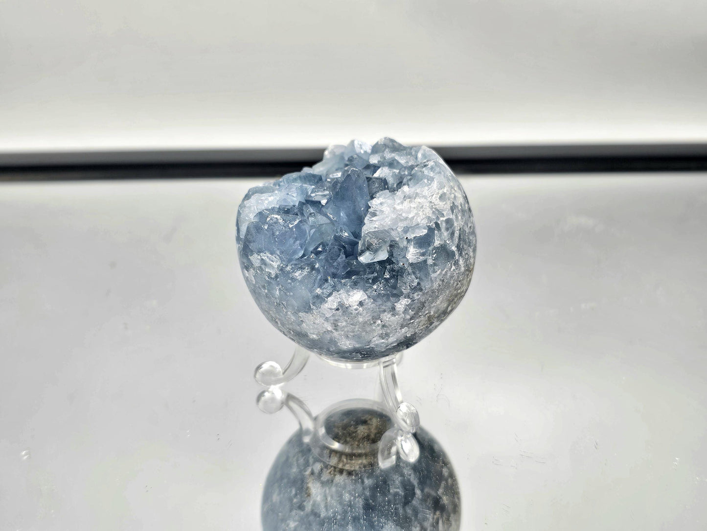 Nature-inspired décor featuring a Celestite Sphere.