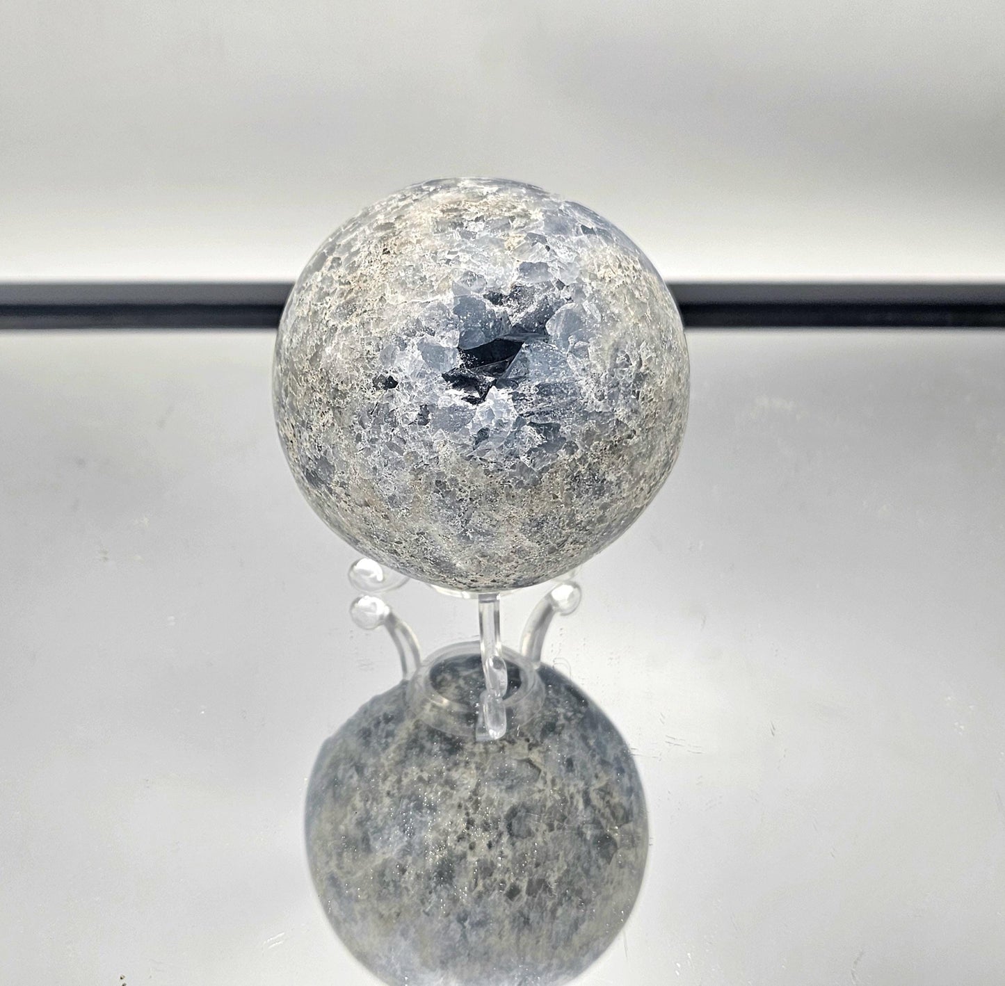 Reiki healing stone Celestite Sphere for energy balance.