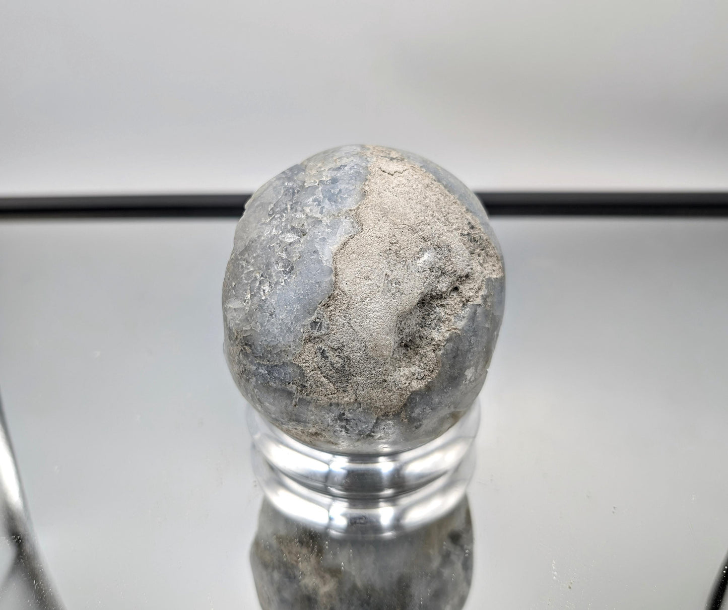 Soothing Celestite Sphere as a calming and elegant décor piece.