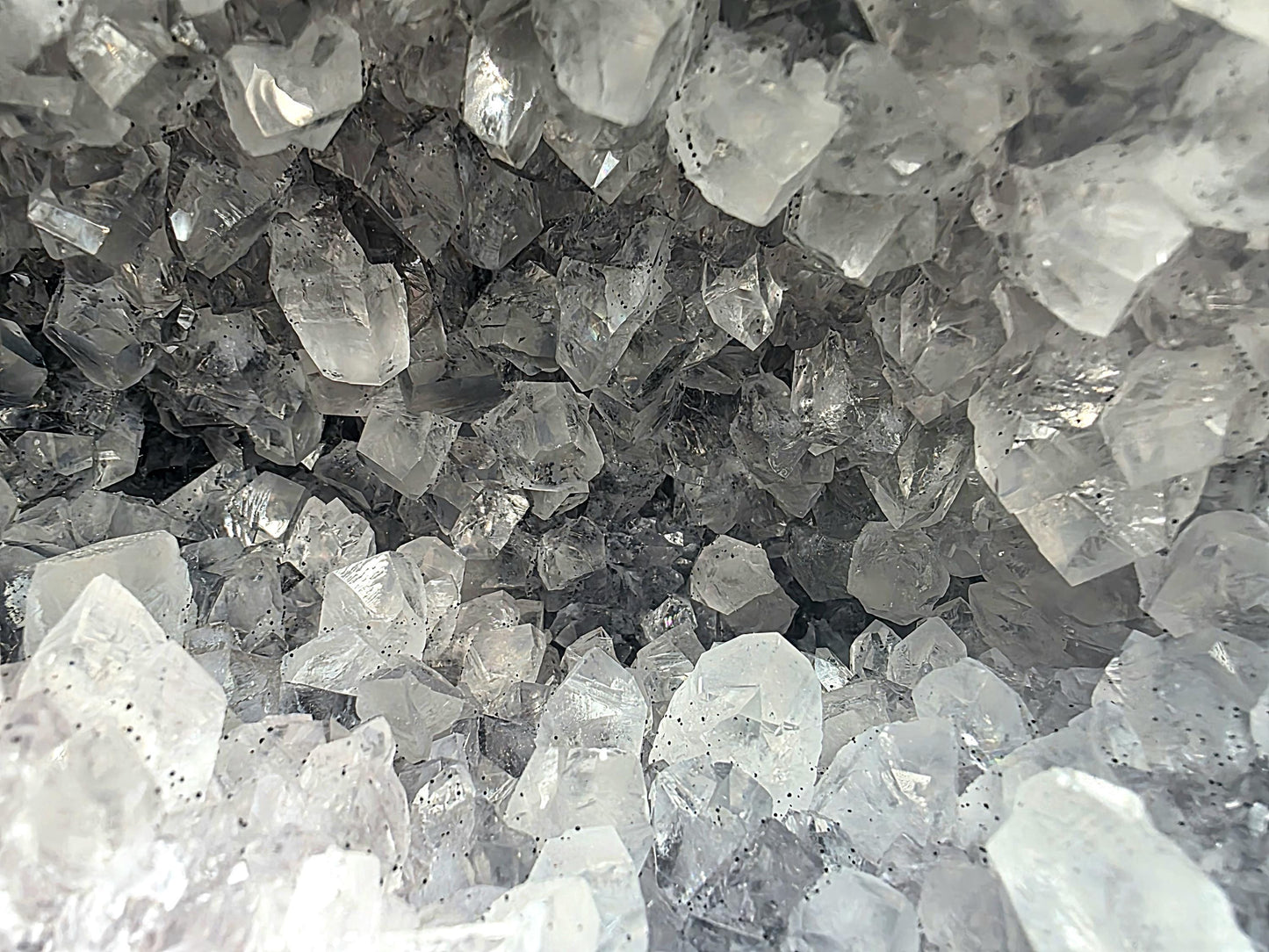 Collector's clear quartz geode with dazzling interiors.