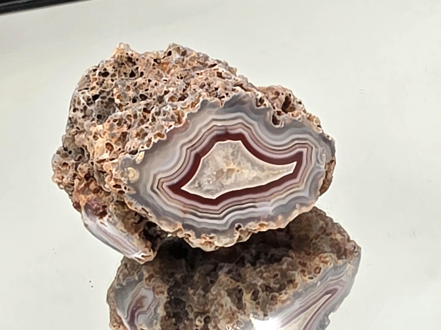Collector’s polished Malawi Agate geode with colour banding.