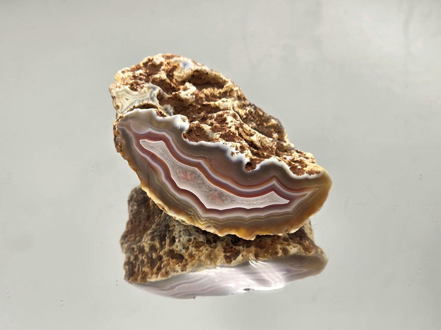 Collector’s Malawi Agate polished geode with colour banding.