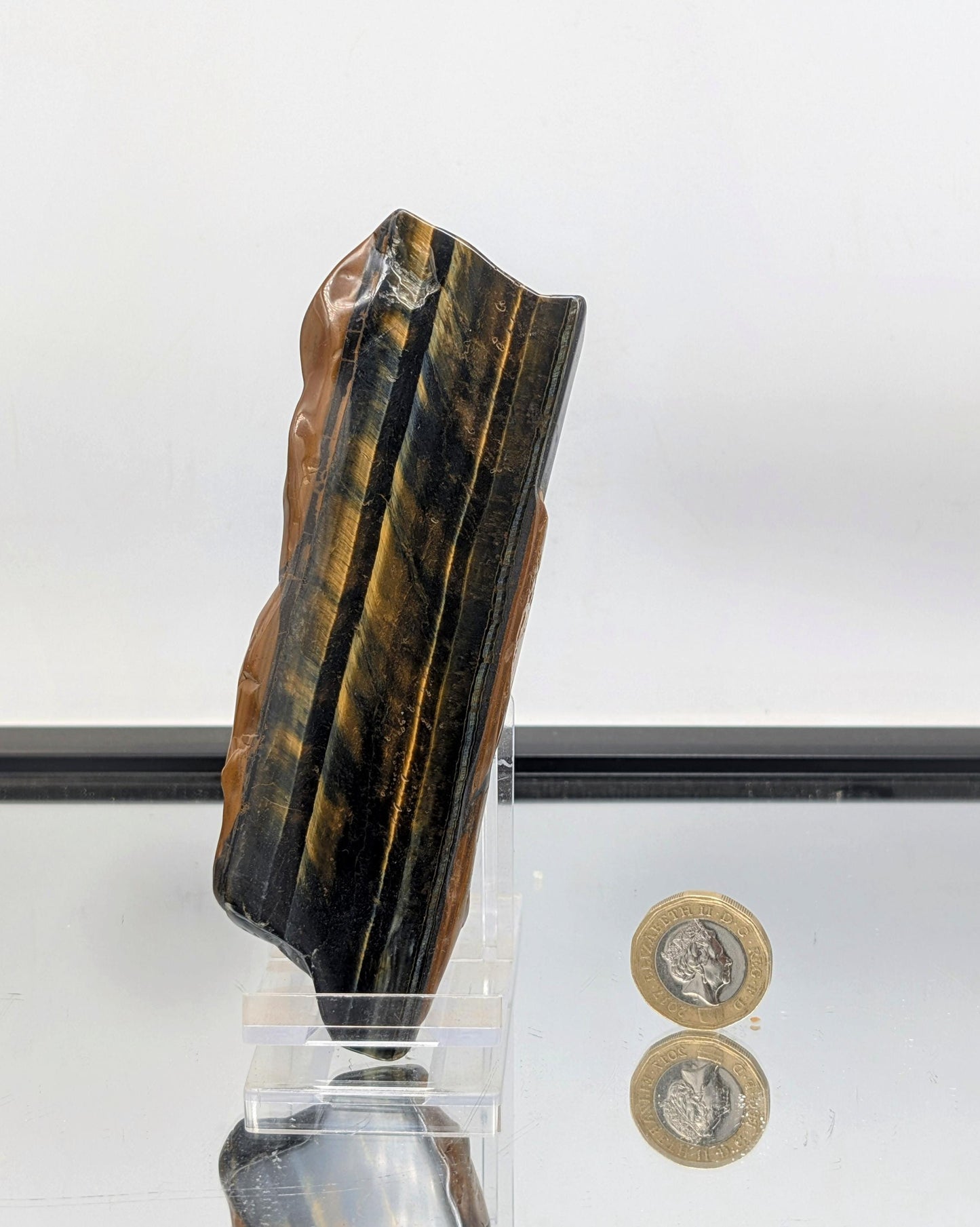 Display-ready Tiger’s Eye crystal slice with natural banding.