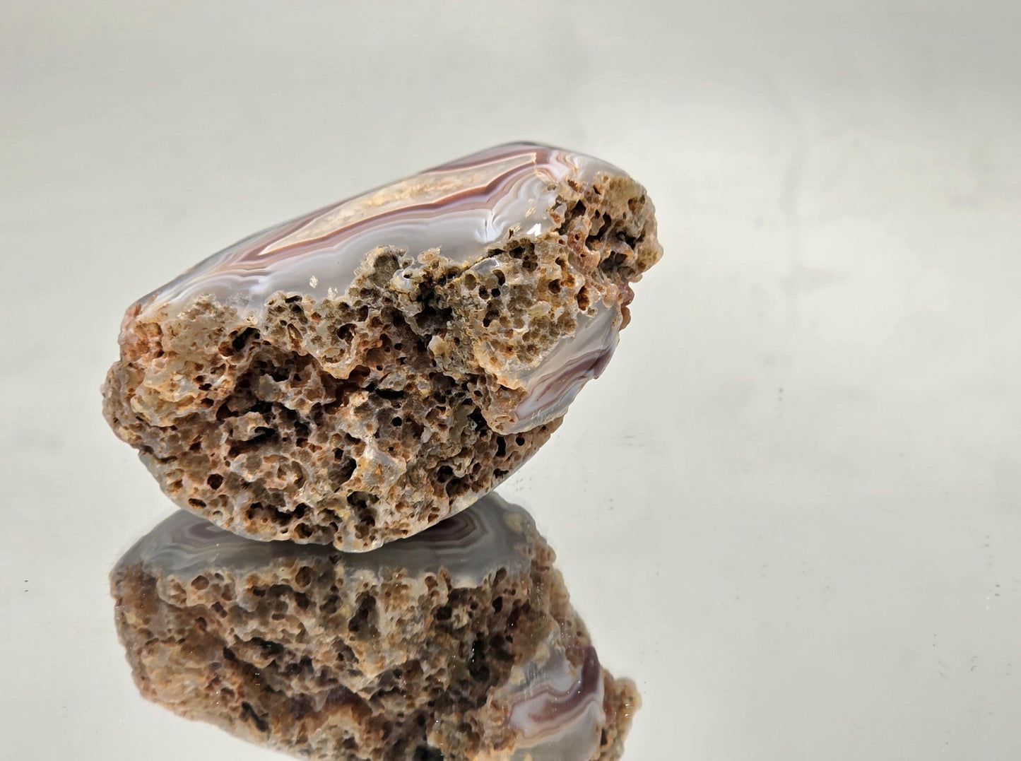 Decorative Malawi Agate polished geode with banding.