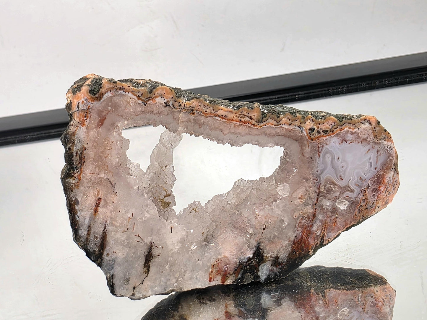 Decorative Moroccan Pink Agate slice polished for display.
