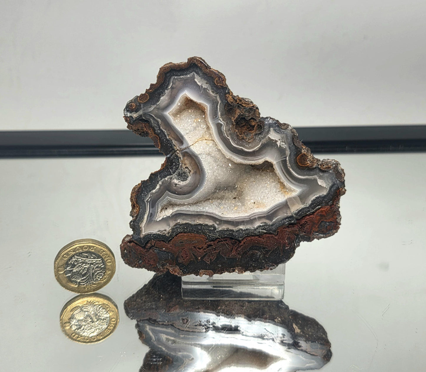 Decorative polished Mexican Agate Geode with layered details.
