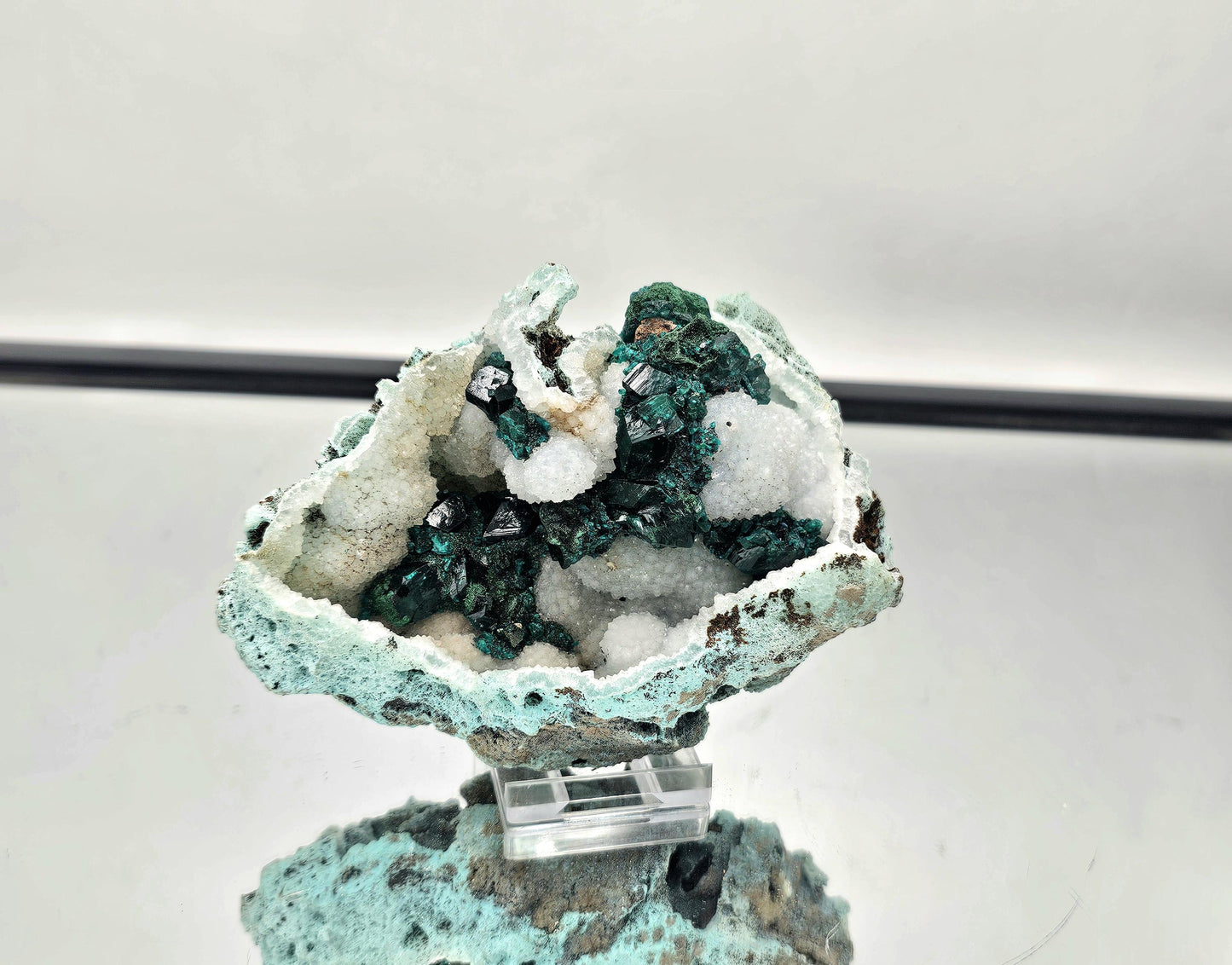 Exceptional Dioptase crystal specimen on Quartz matrix, featuring vibrant green Dioptase crystals.