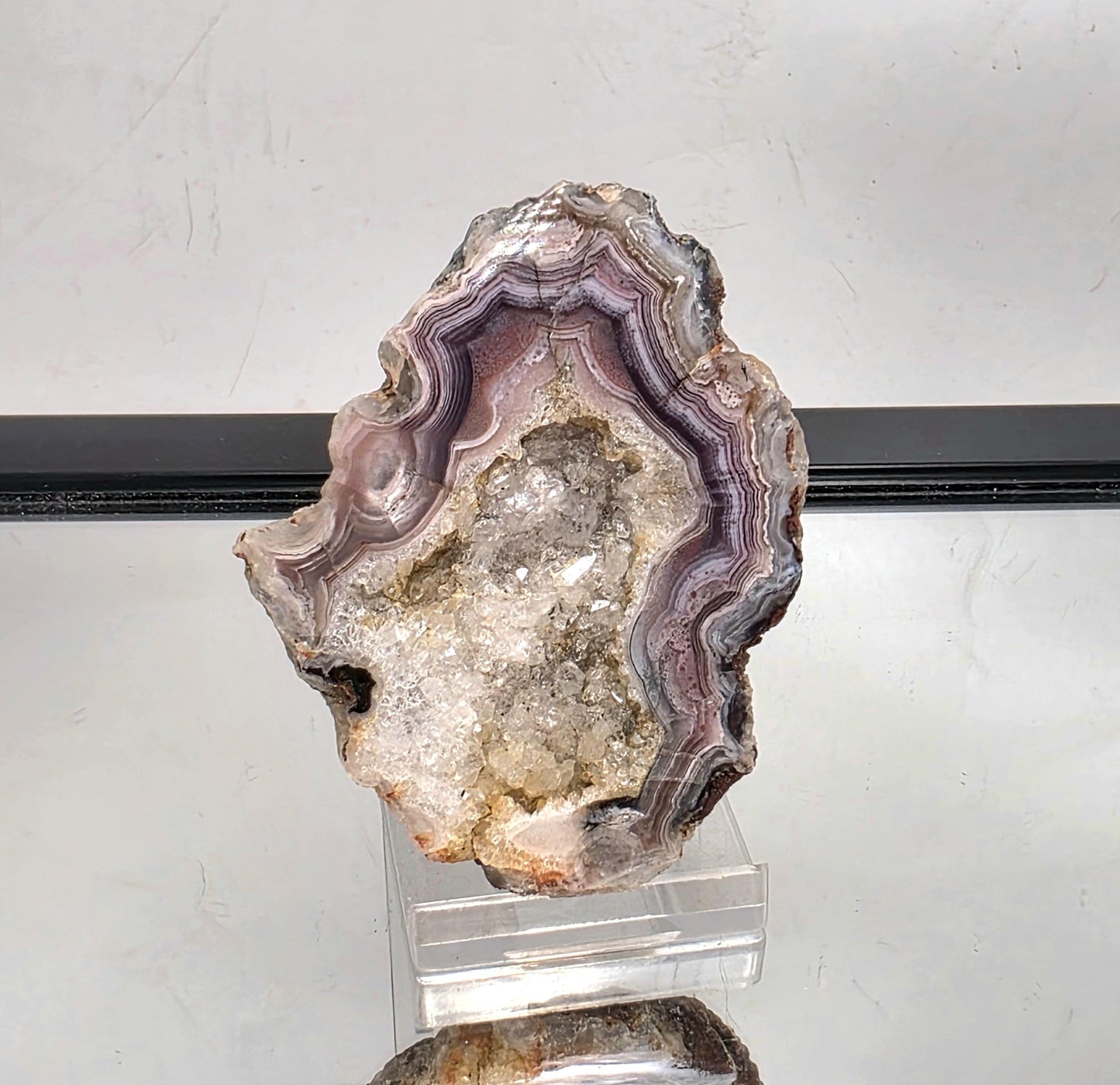 polished Mexican Agate Geode with unique banding detail.