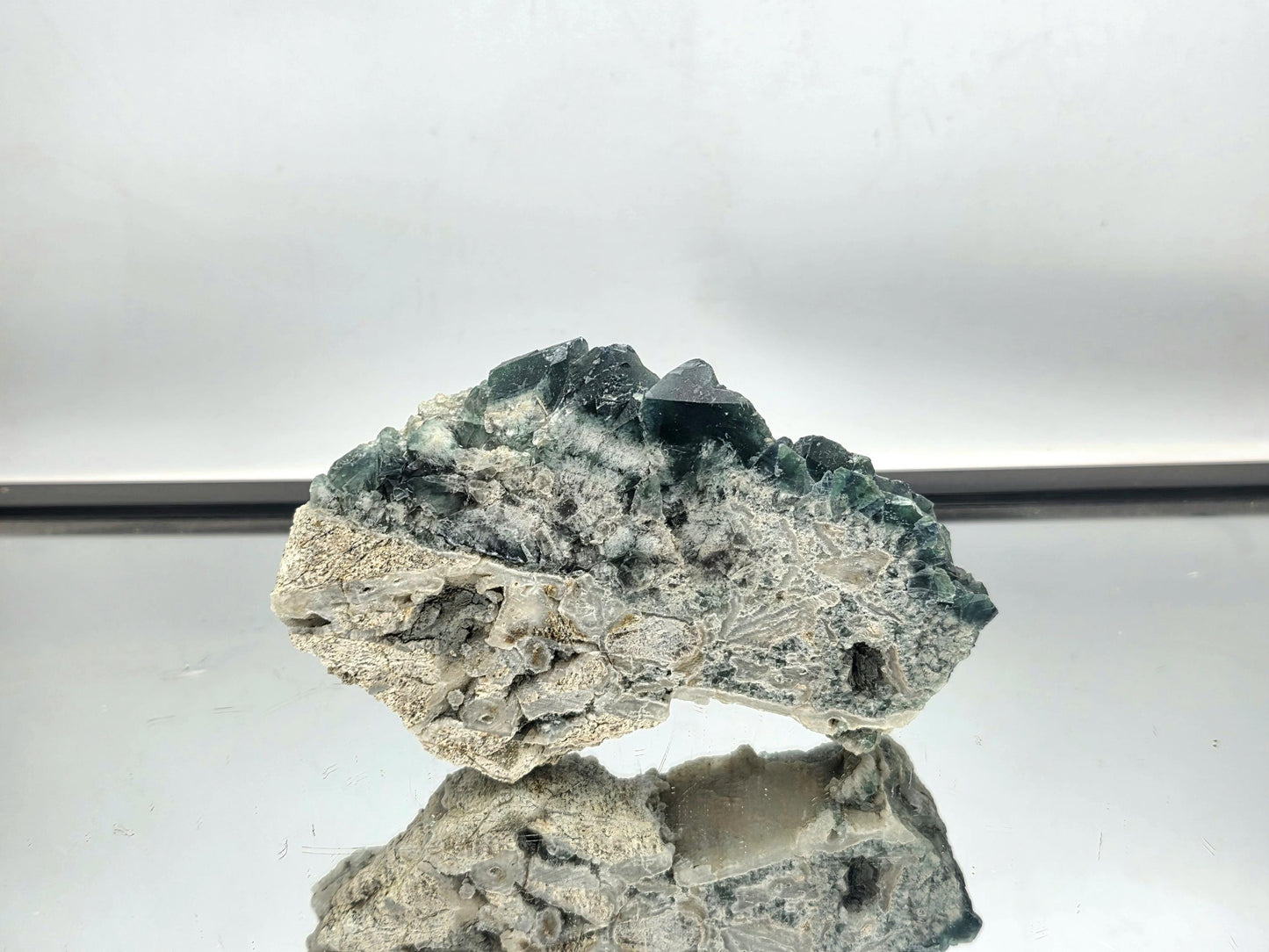 Fluorite crystal slice with natural zoning and polished edges.