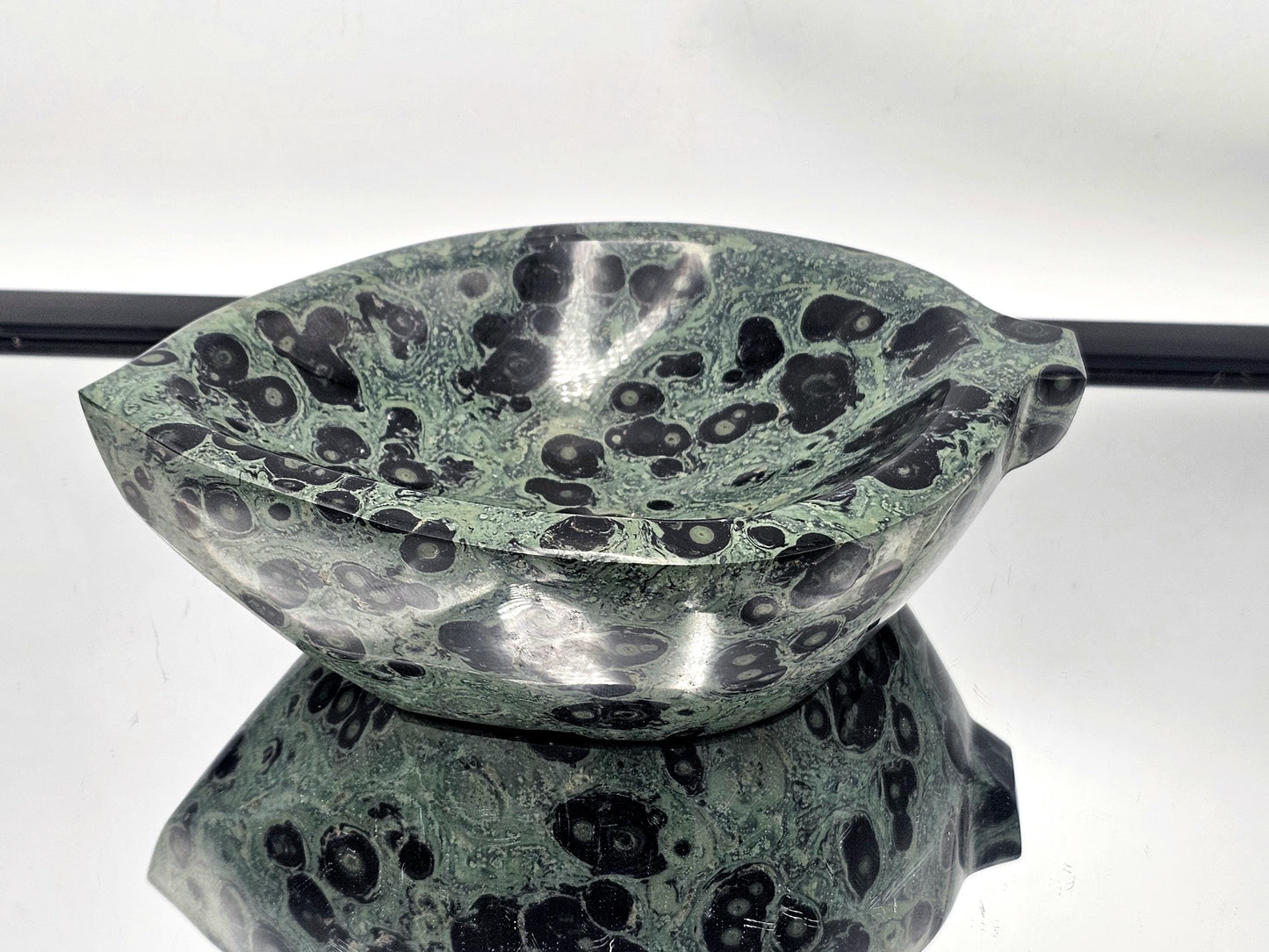 Hand-carved green Jasper bowl with natural patterns.