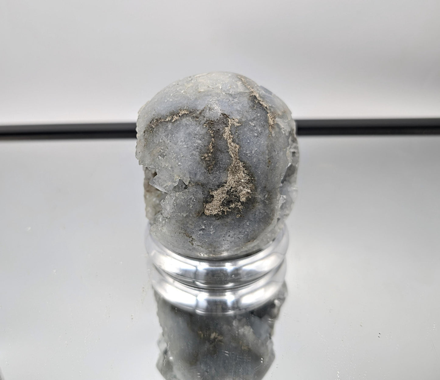 Hand-polished Celestite Sphere from Madagascar, perfect for collectors.
