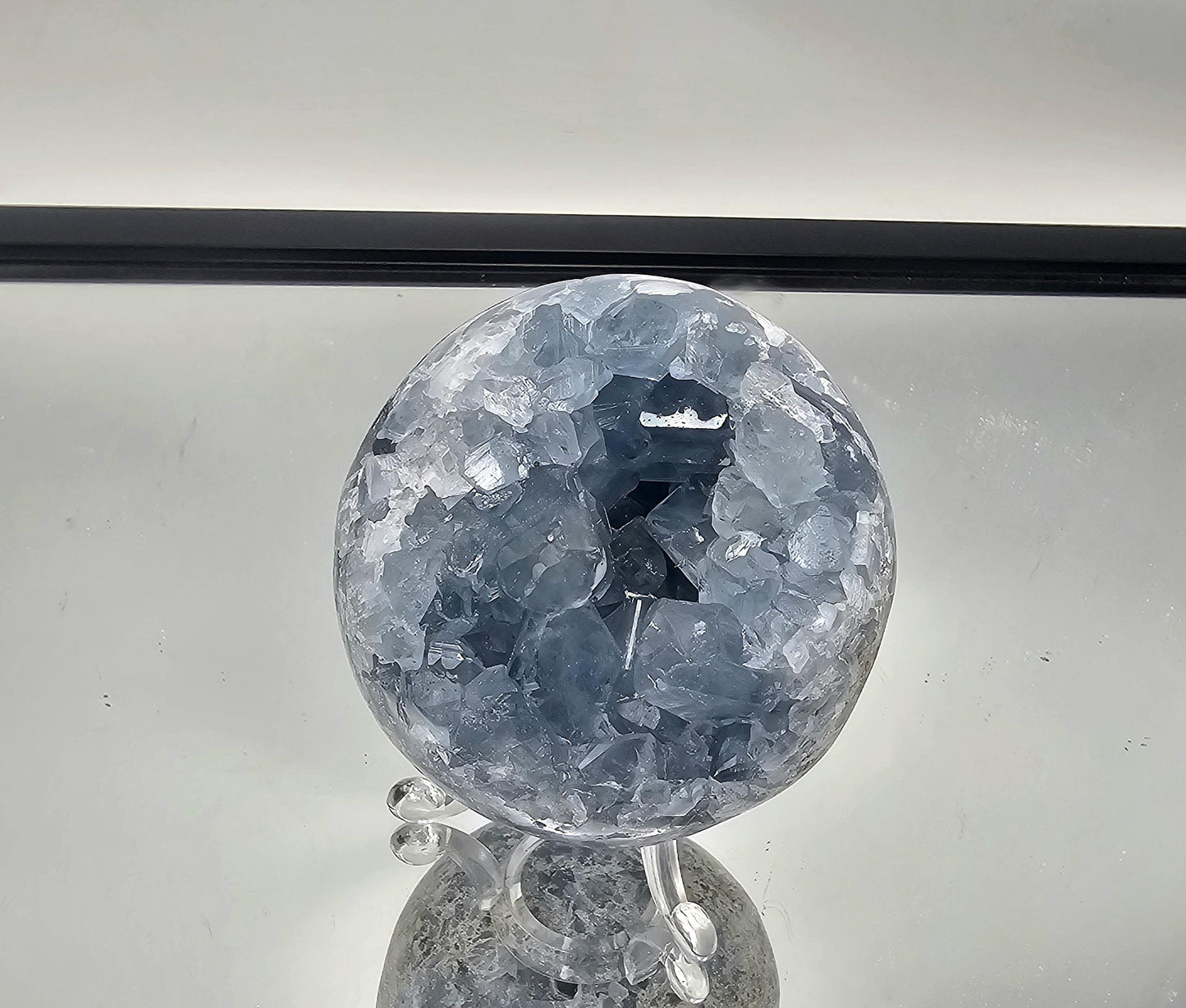Hand-polished Celestite Sphere from Madagascar, perfect for collectors.