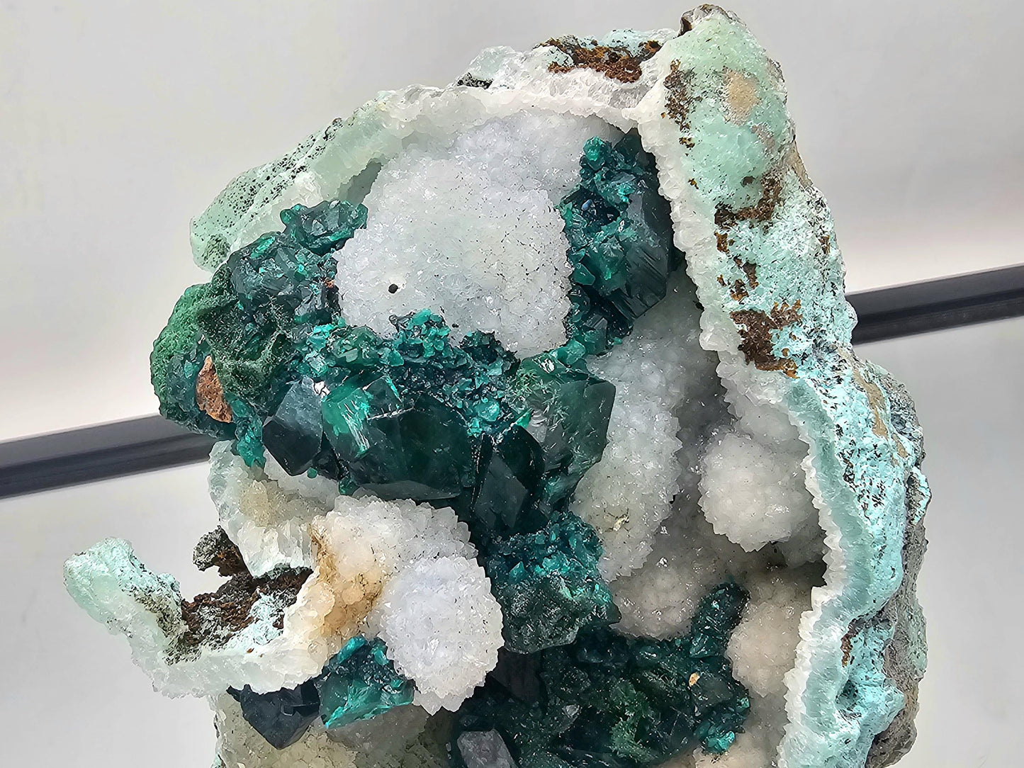 Beautiful Dioptase crystal specimen on a Quartz matrix, showing off its brilliant green hue and natural beauty.