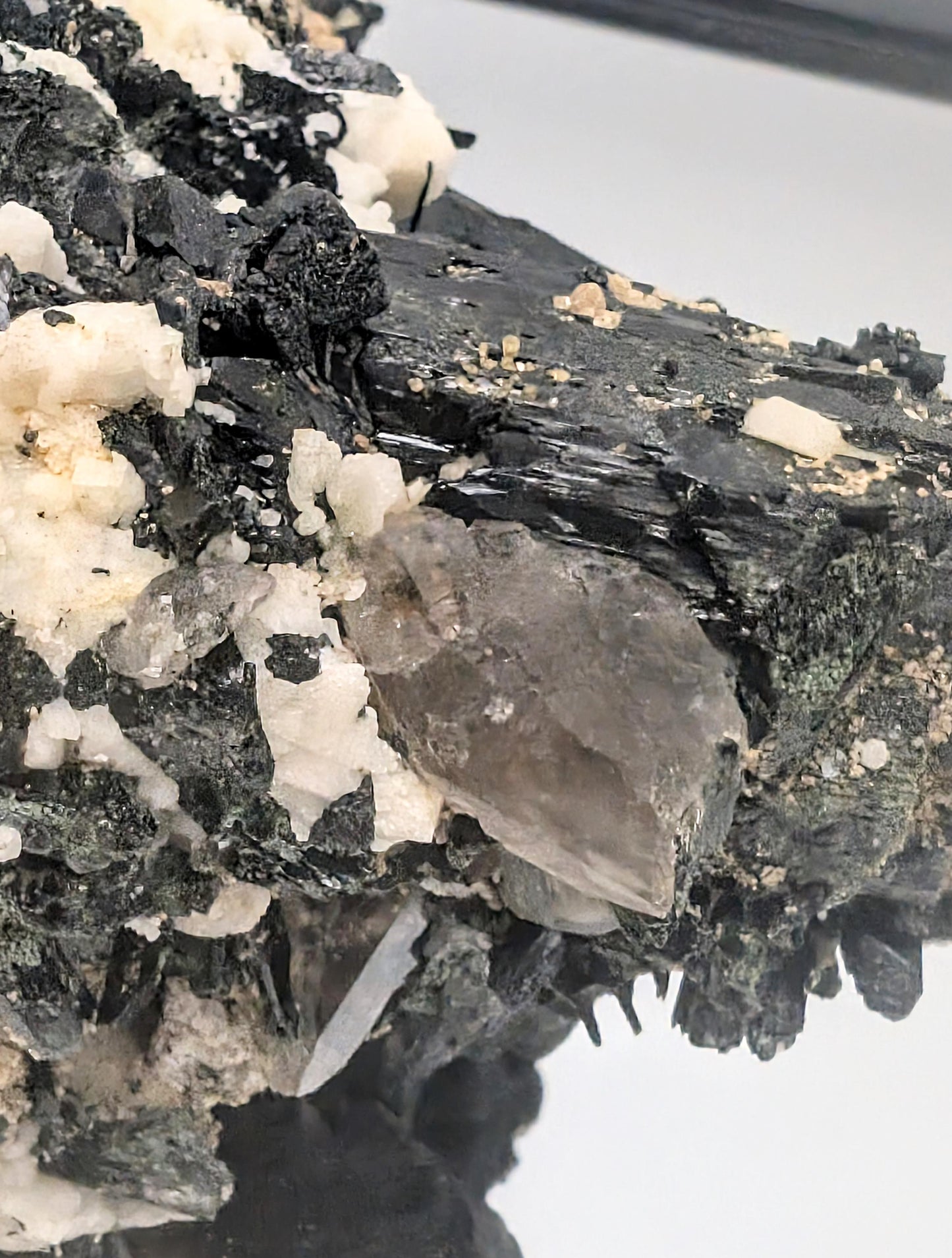 Sculptural specimen with intense contrast and sharp crystal forms.