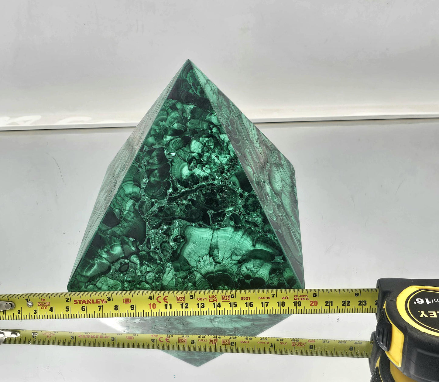medium Malachite pyramid for upscale interior design and crystal enthusiasts.