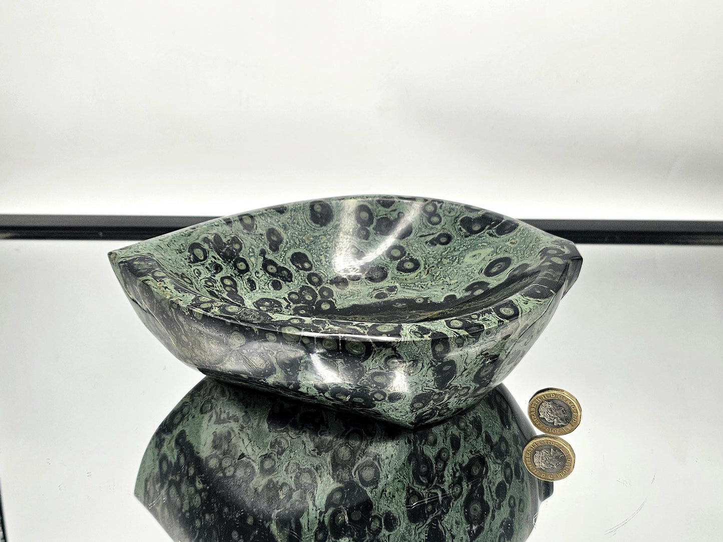 Hand-carved Kambaba Jasper leaf bowl with natural green patterns.