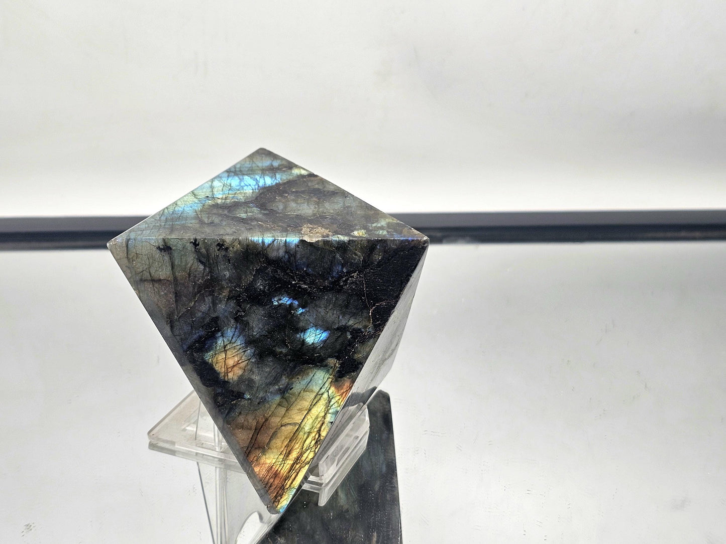 Labradorite Crystal Pyramid, ideal for holistic decor or enhancing home interiors.