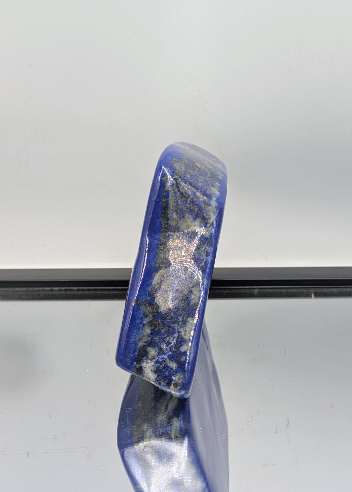 Natural Lapis Lazuli showcasing deep blue tones and pyrite shimmer.