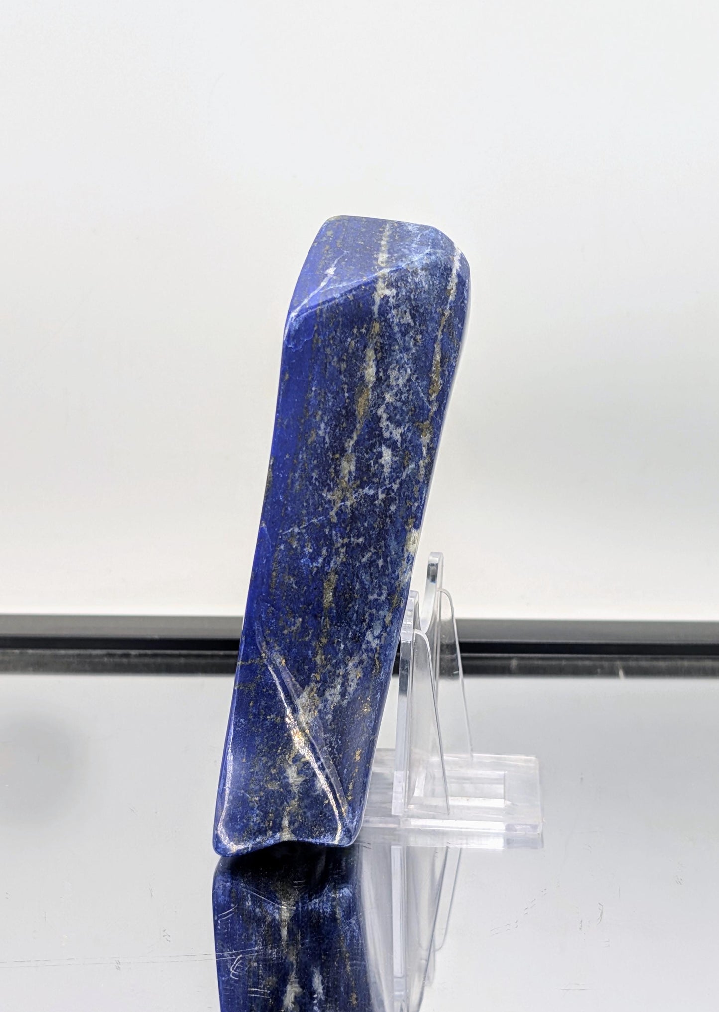Polished Lapis Lazuli freeform stone with deep, royal colouring.