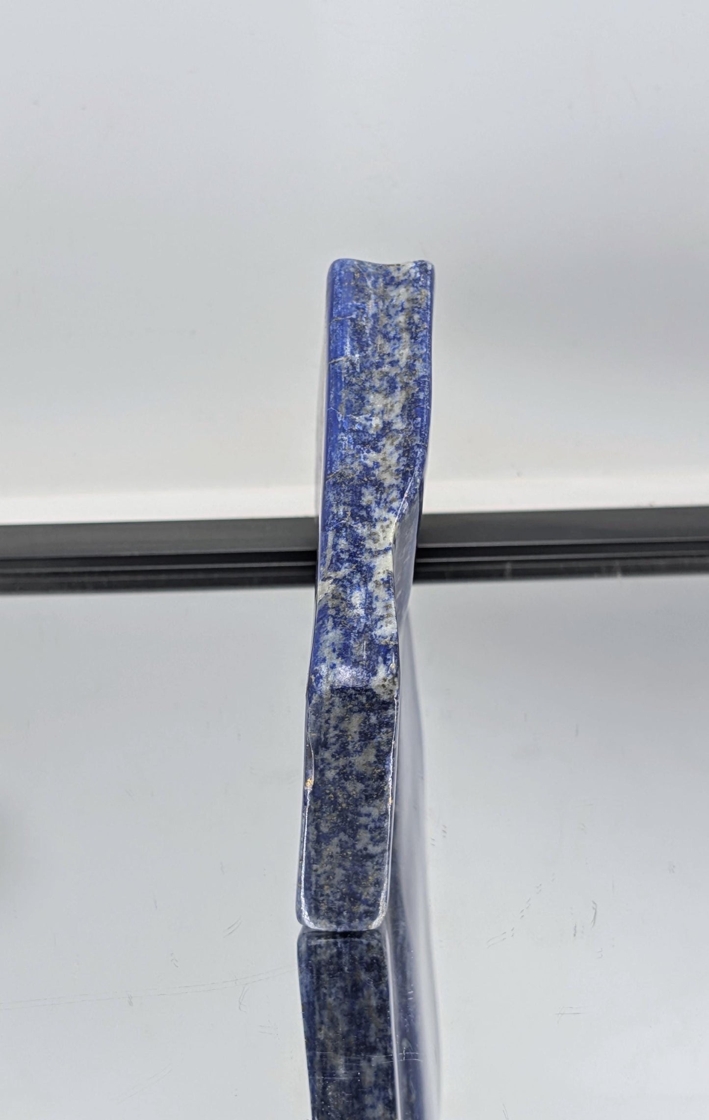 Decorative polished Lapis Lazuli freeform with royal blue tones.