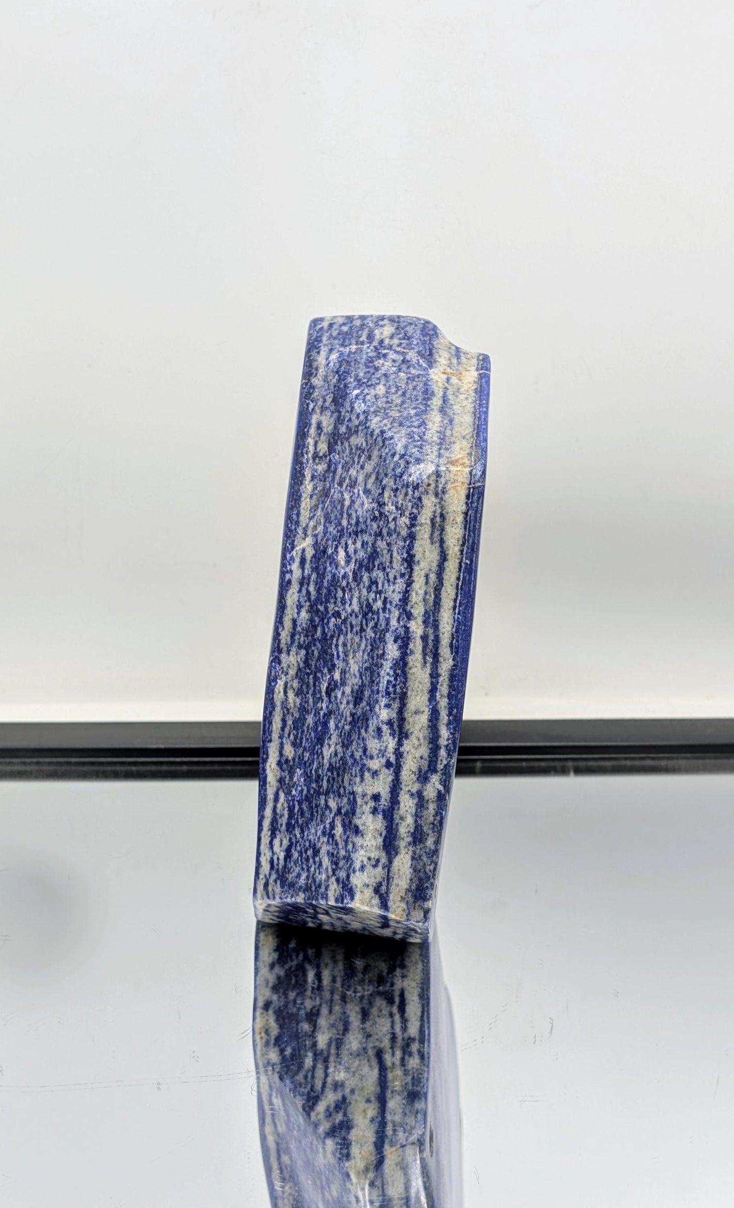Natural stone polished Lapis Lazuli with freeform curves.