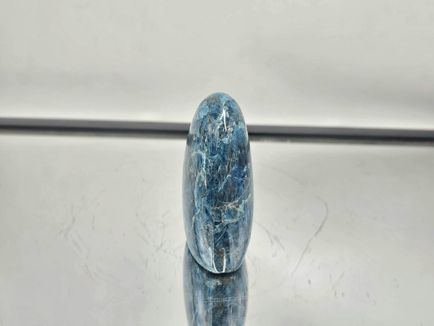 Polished Blue Apatite crystal with natural hues, ideal for display or decor.
