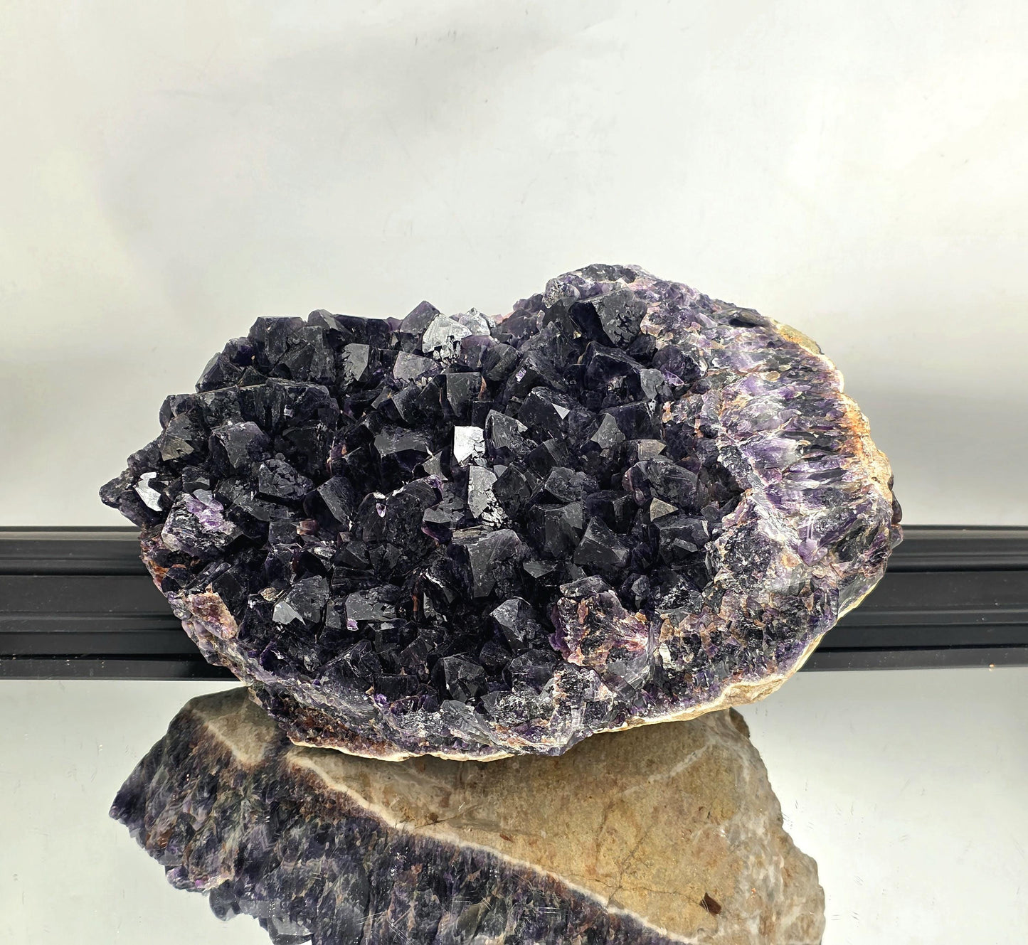 Large Zambian amethyst crystal cluster with rich deep purple hues.