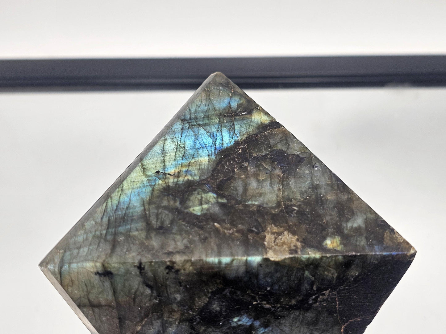 Labradorite Crystal Pyramid, hand-carved from Madagascar, perfect for decor.
