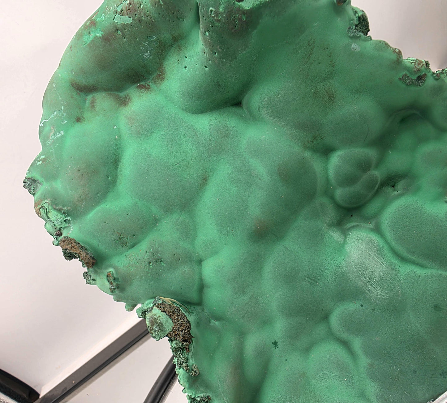 Substantial malachite slab exhibiting the stone's natural appearance.