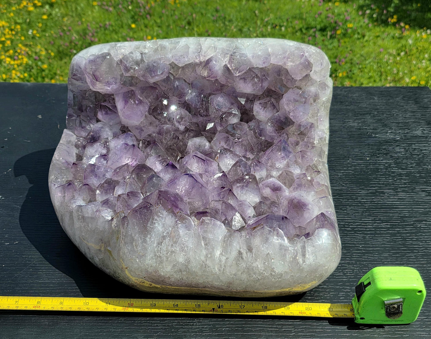 Large natural Brazilian Amethyst crystal cluster with polished surface.