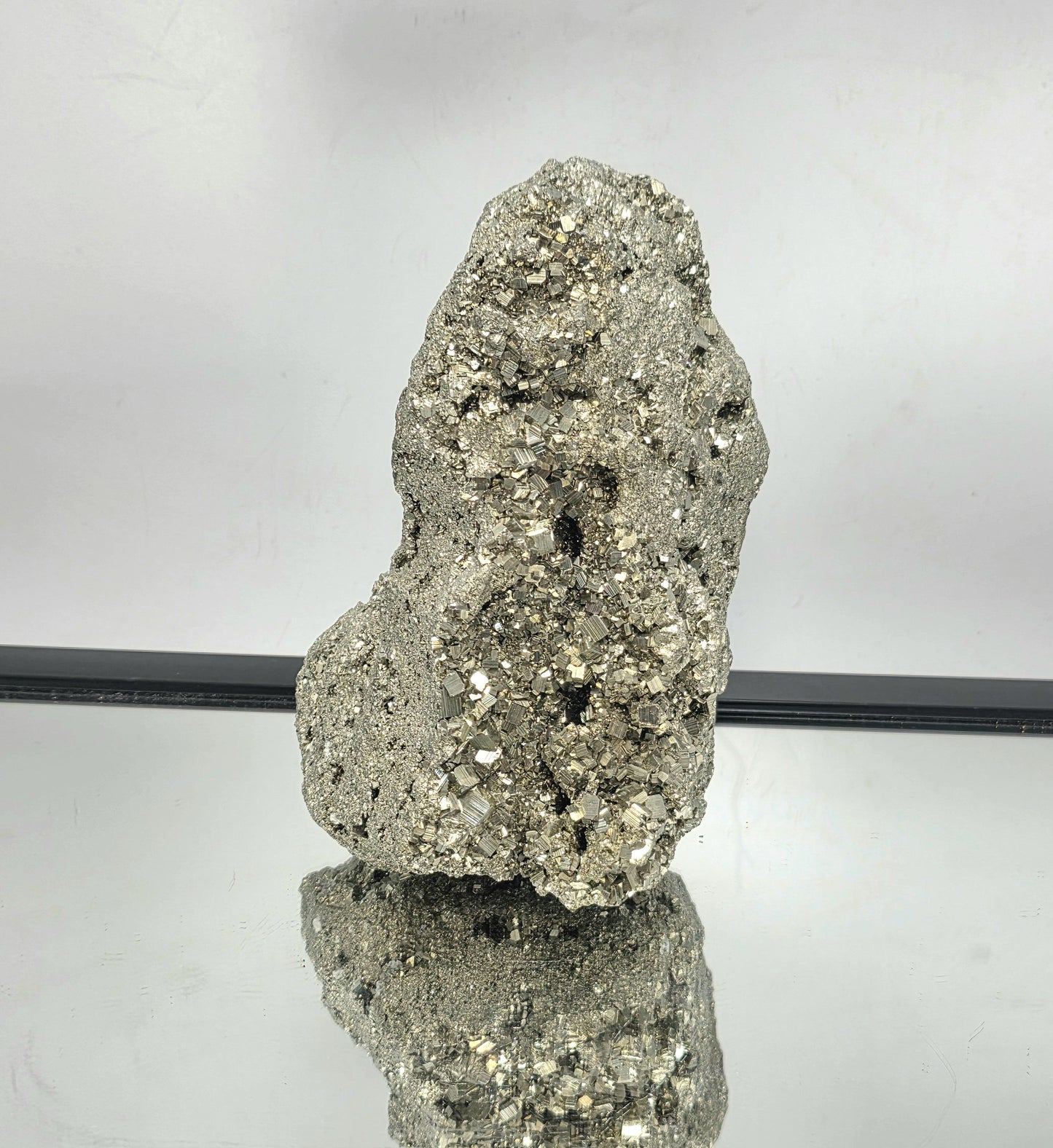 Large Pyrite crystal cluster with bold metallic luster.