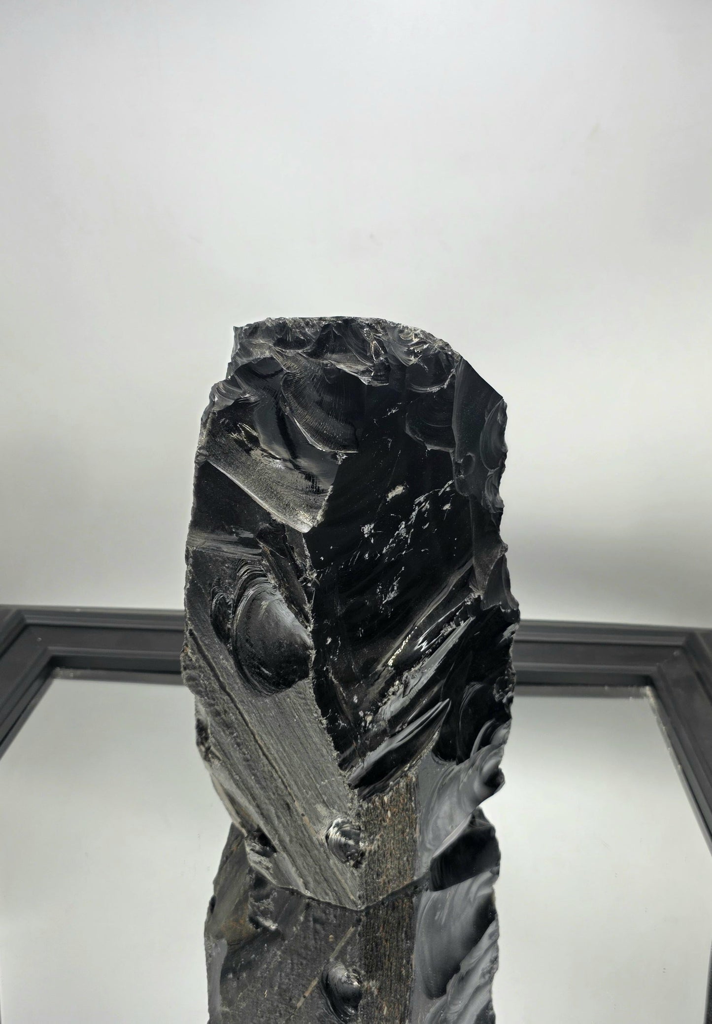 Large raw Obsidian crystal with rough texture, ideal for Wabi-Sabi interiors.