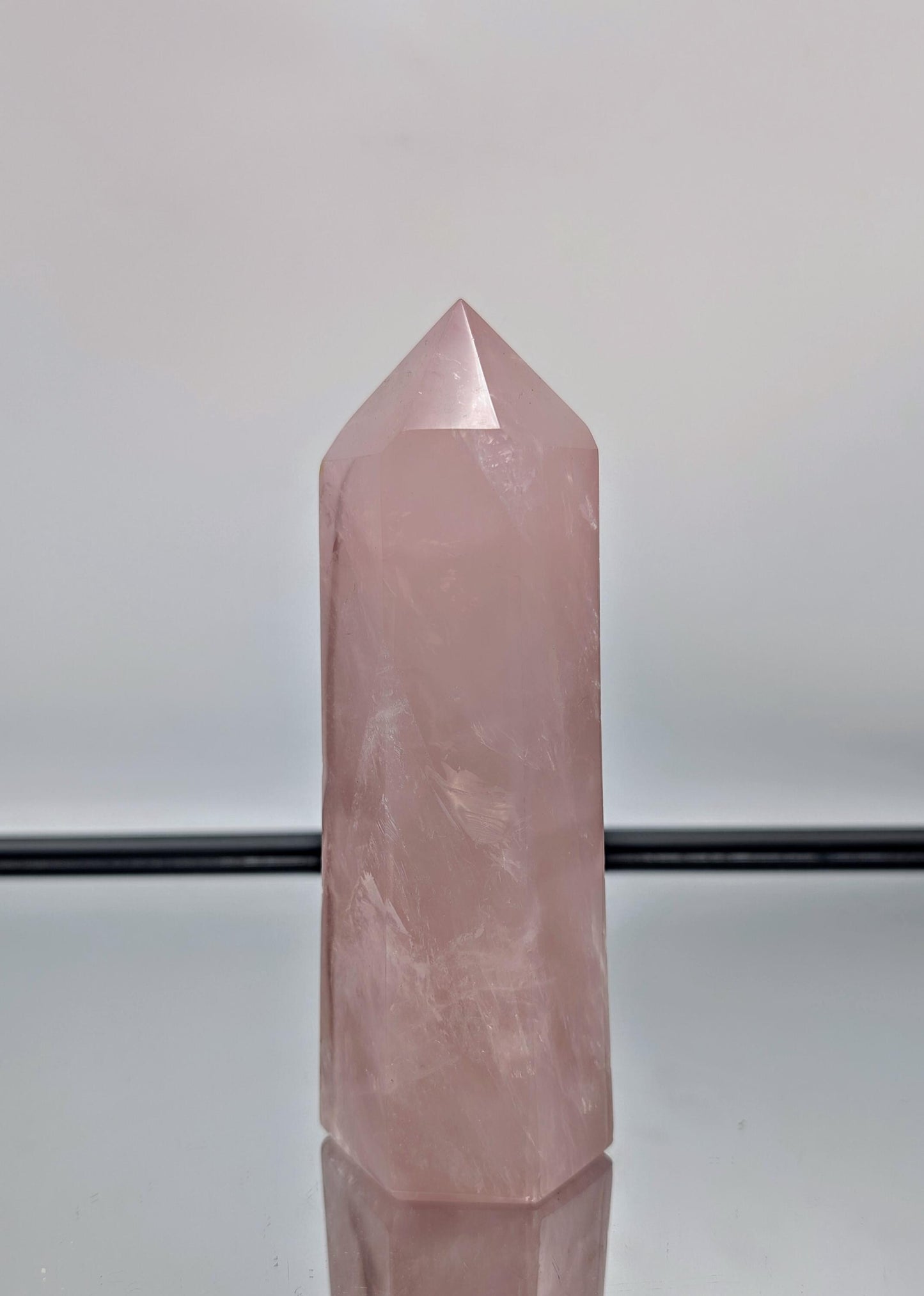 A breathtaking large rose quartz prism, handcrafted in Madagascar for home décor.