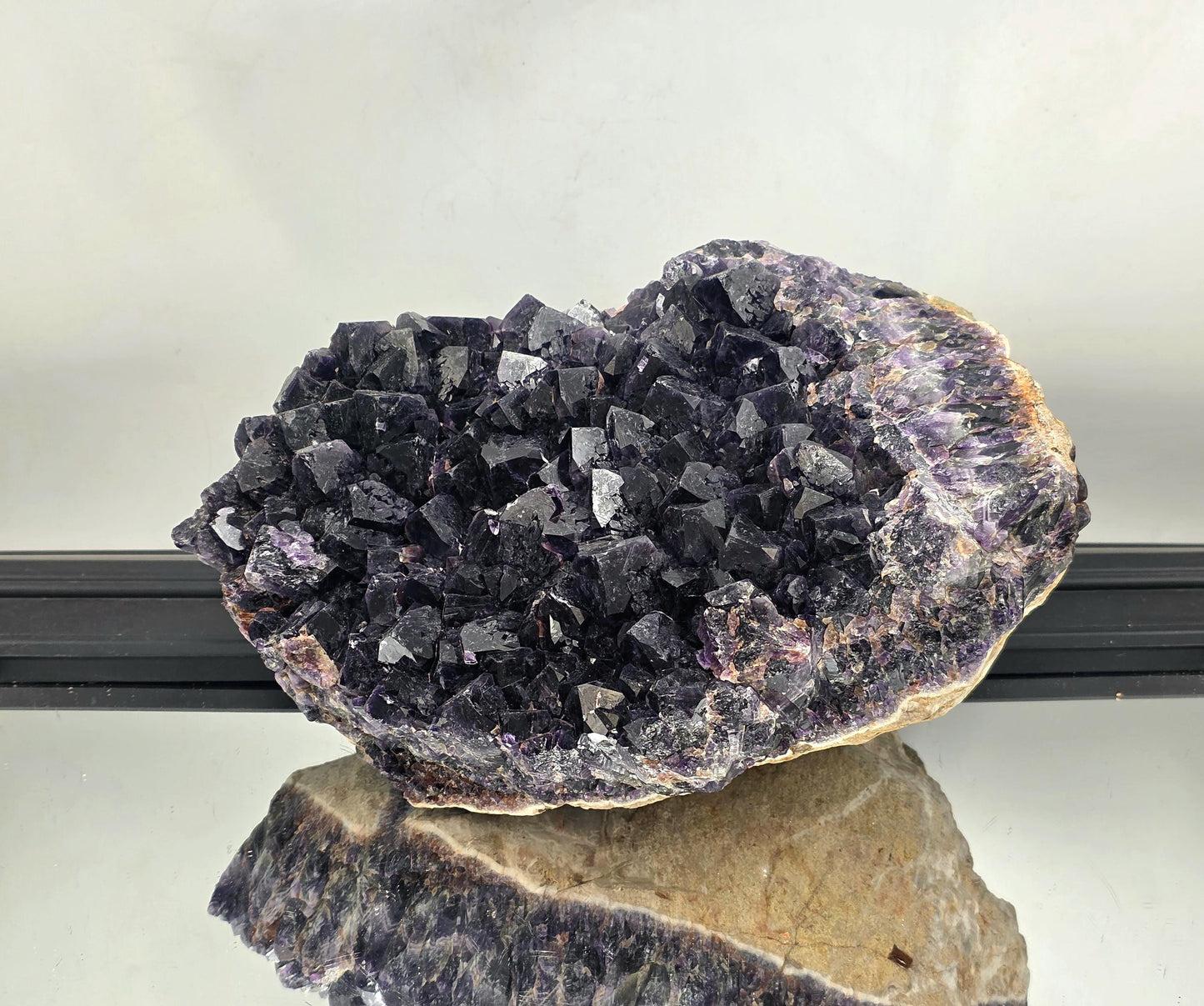 Large Zambian amethyst crystal cluster featuring rich violet hues.