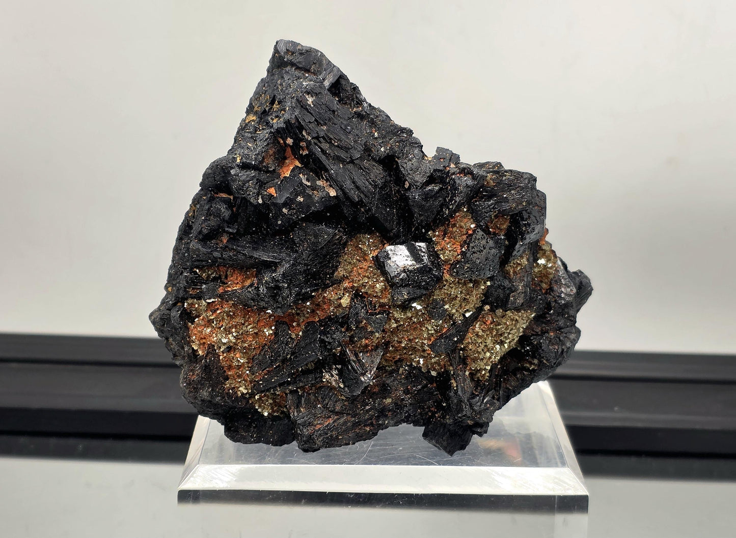 Large black tourmaline crystal specimen with mica, grounding mineral.