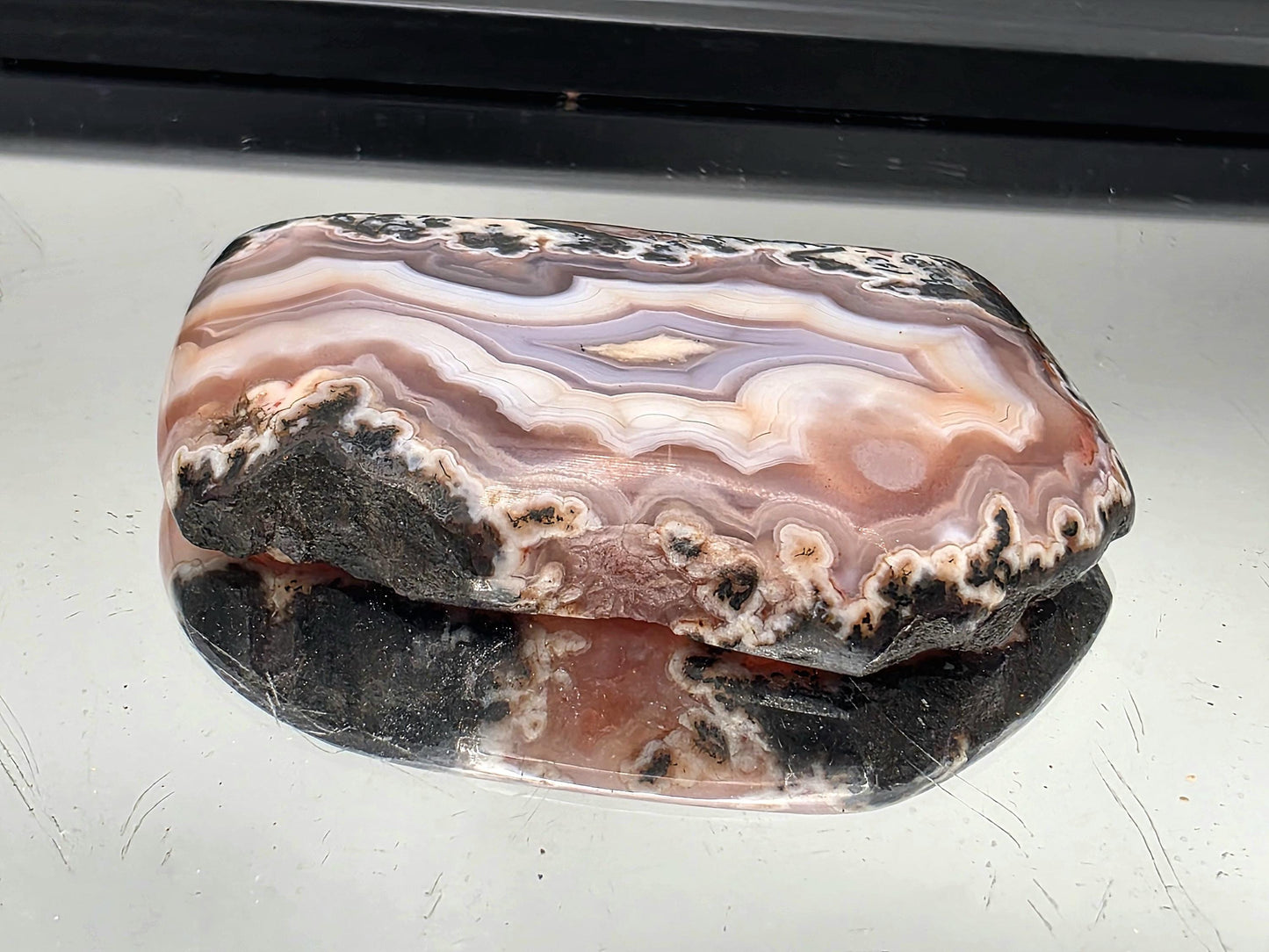 Rare collector-grade lavender agate slice from Aouli, Morocco.
