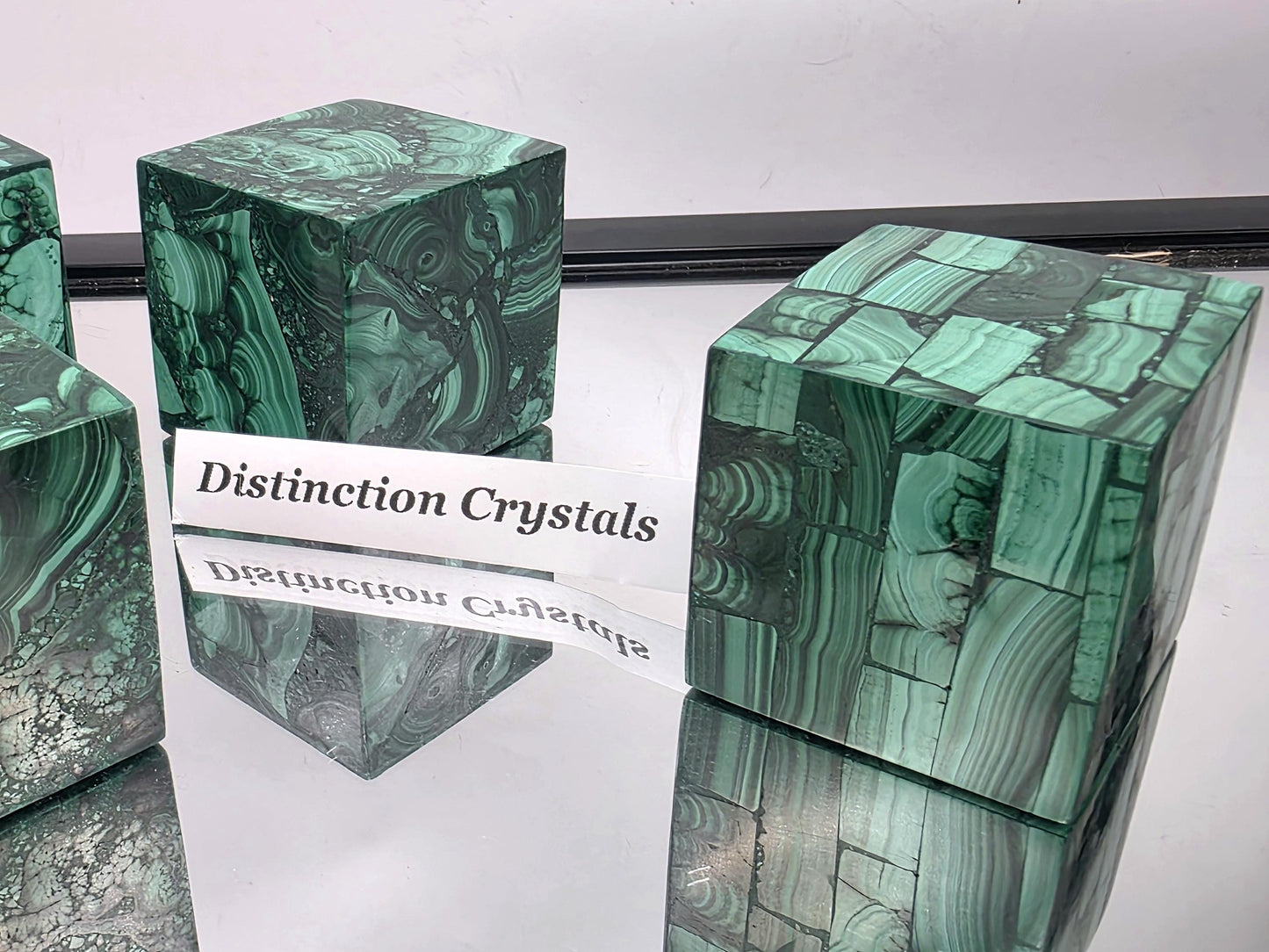 Malachite cube with other crystal décor pieces.