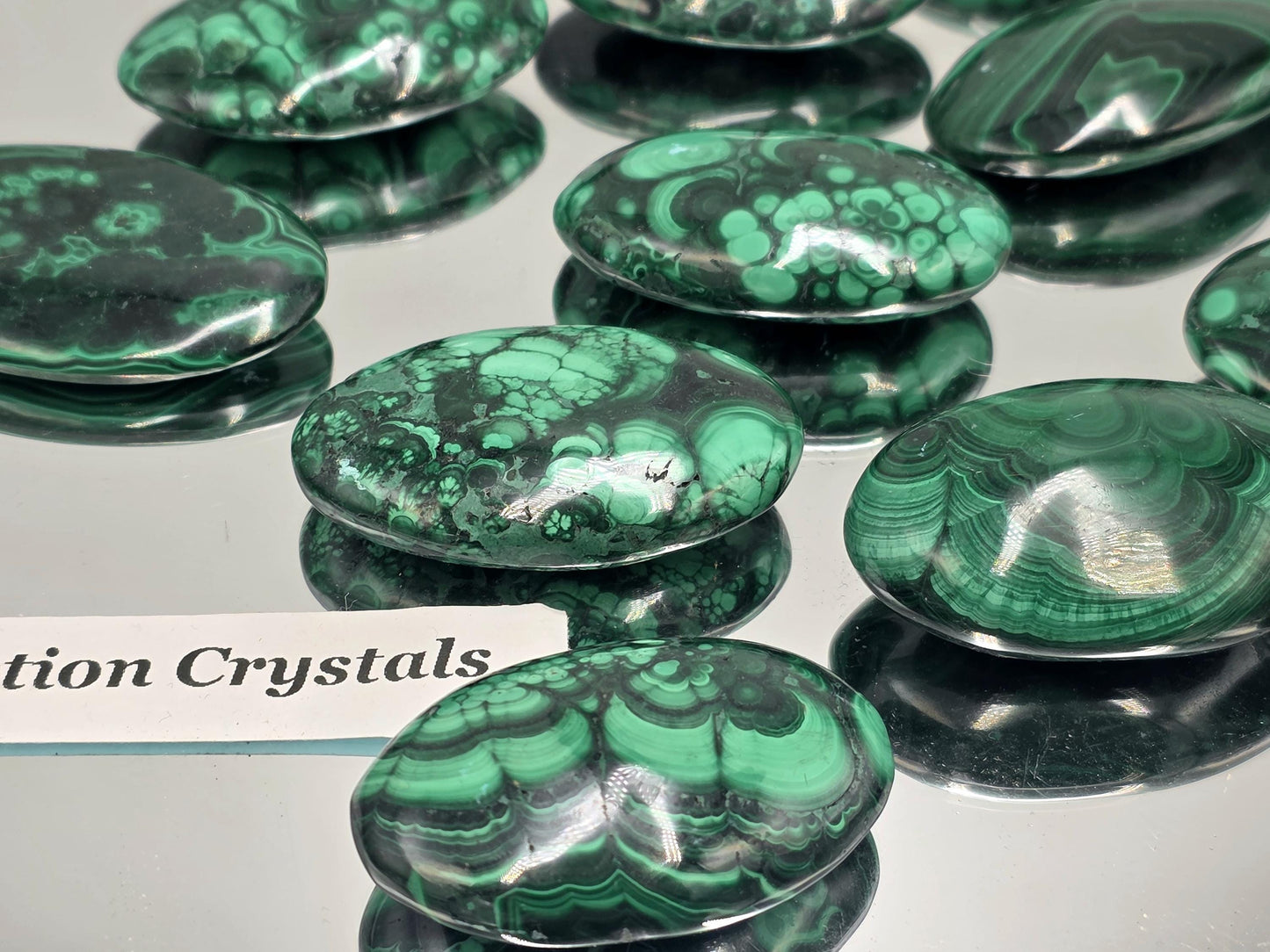 Hand-polished Malachite palmstone for collectors and décor.